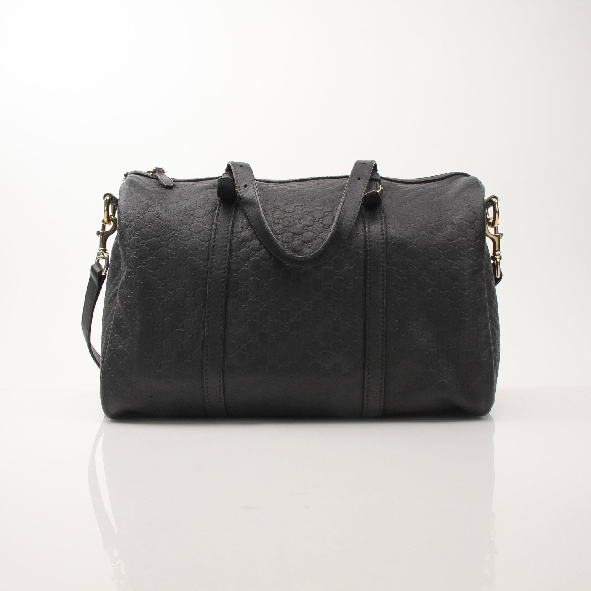 Black Gucci Joy Boston handbag by Gold & Beyond, showing the stylish leather tote with gold-tone accents and top handles.
