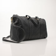 Black Gucci Joy Boston handbag with gold-tone accents, featuring sturdy handles and a spacious interior for everyday use.