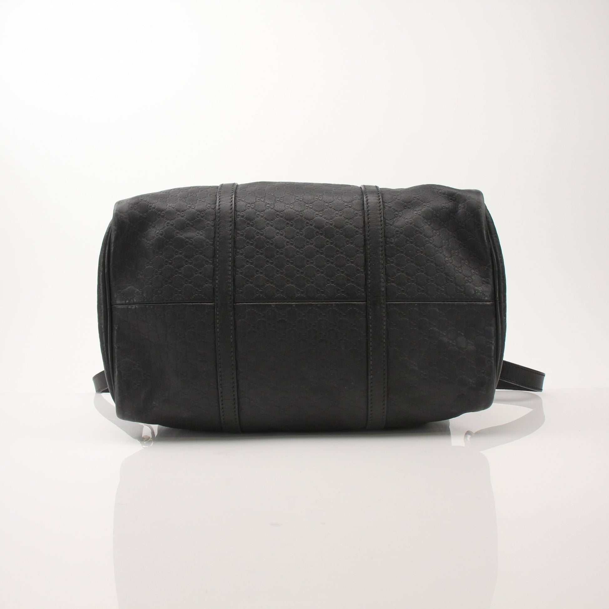 Gucci Black Joy Boston Bag handbag with gold accents and structured design, featuring handles and spacious interior.