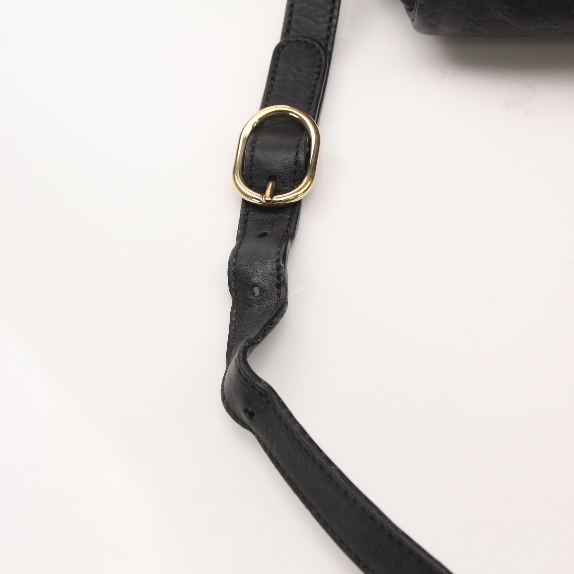 Black Gucci Joy Boston Handbag with gold accents, featuring a structured design and top handles.