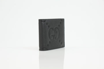 Gucci GG embossed leather bifold wallet in black with a textured finish and multiple card slots.
