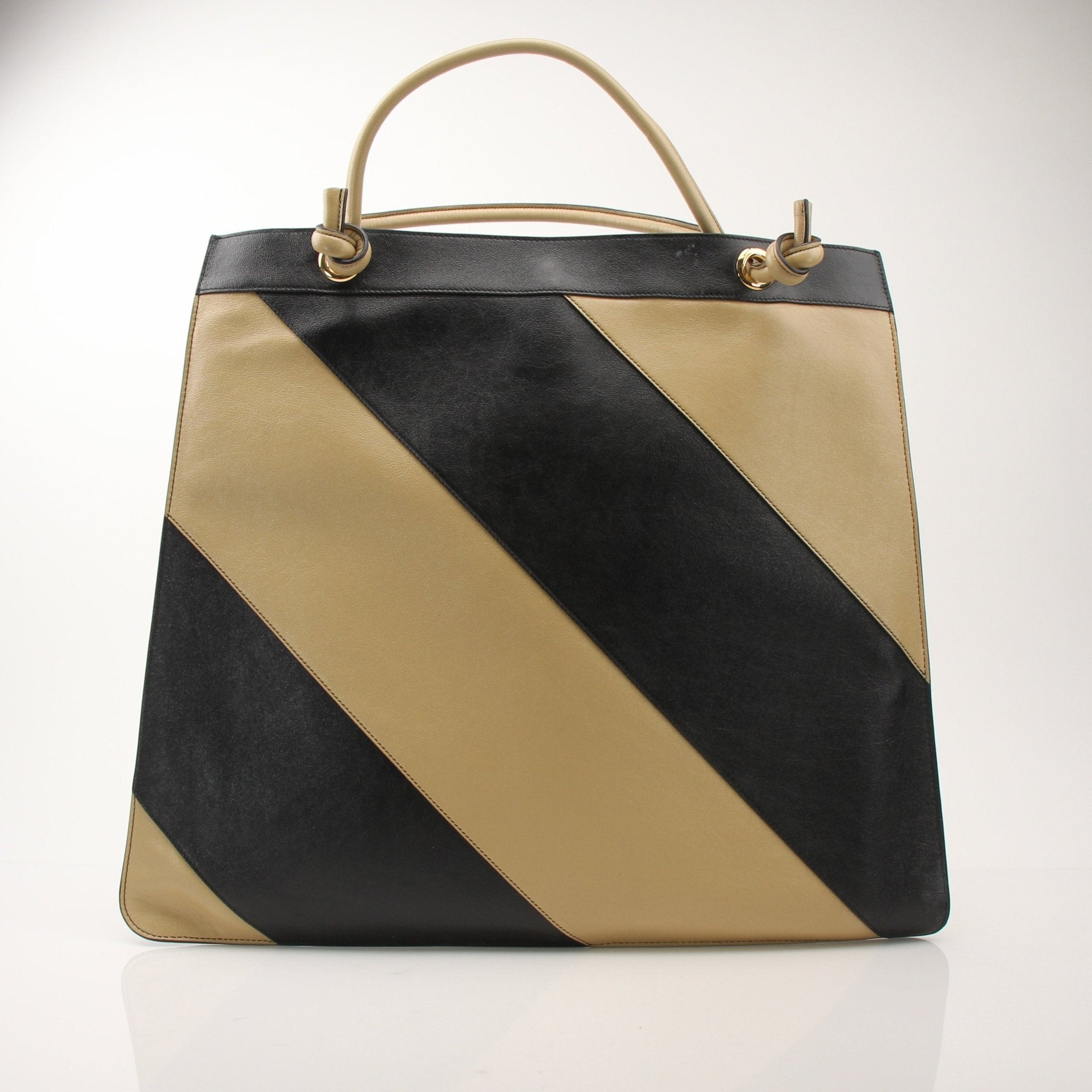 Gucci Zumi tote handbag by Gold & Beyond, featuring beige canvas with brown leather accents and gold hardware details.