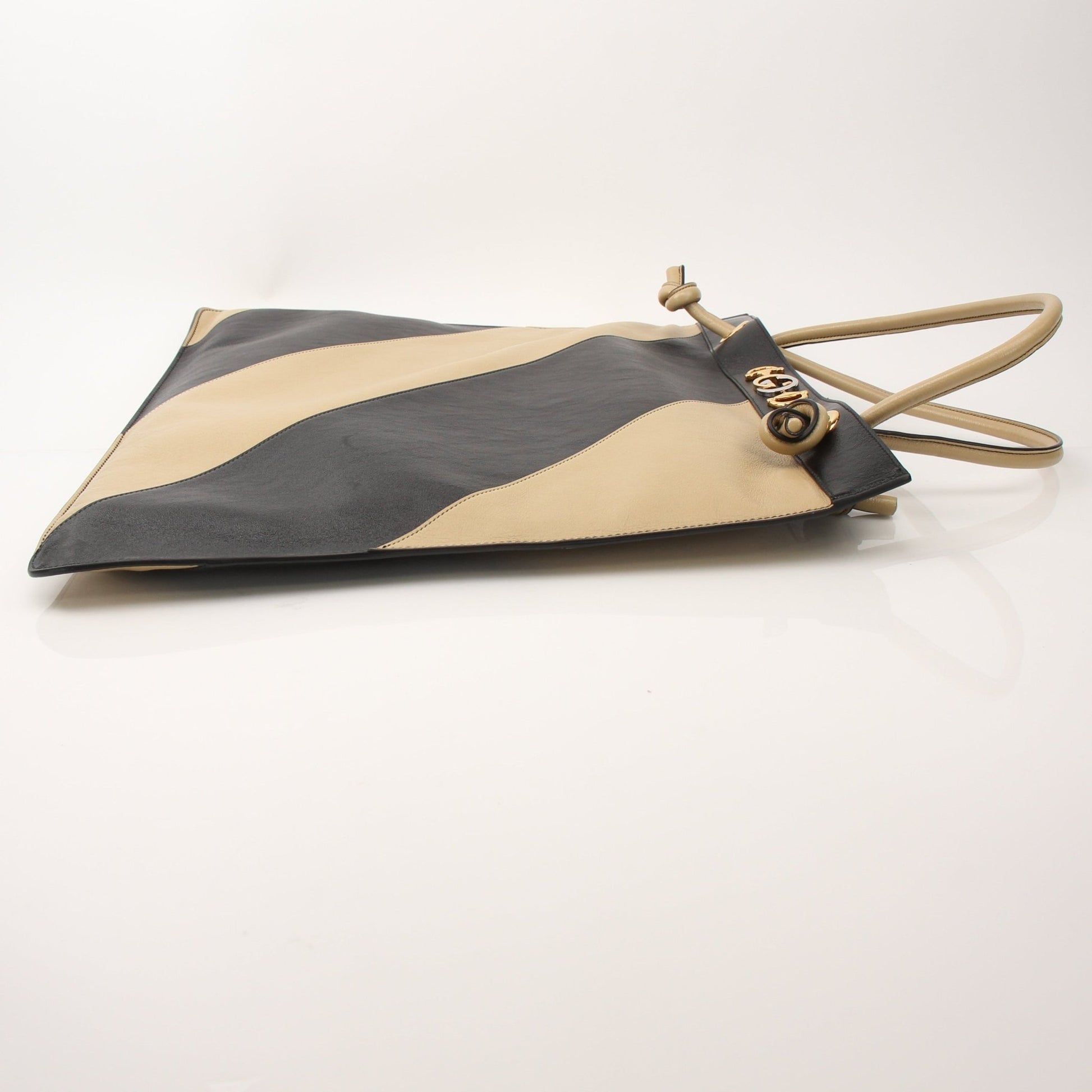 Gold & Beyond Gucci Zumi Tote Bag handbag with structured design and signature logo details, displayed on a neutral background.