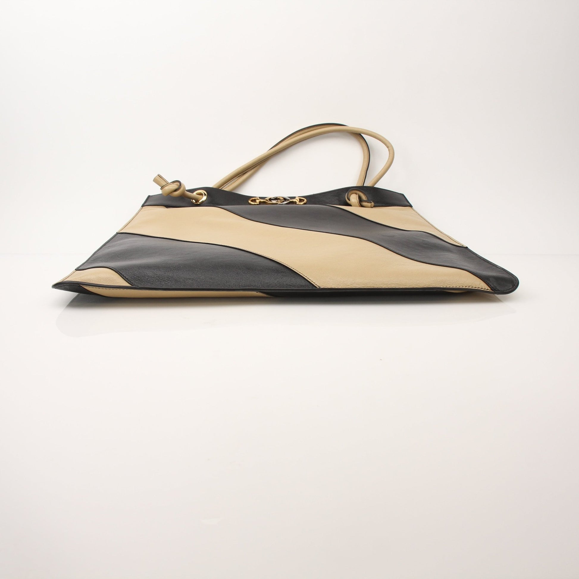 Gold & Beyond Gucci Zumi Tote Bag handbag with leather handles and gold accents, featuring a stylish design and spacious interior.