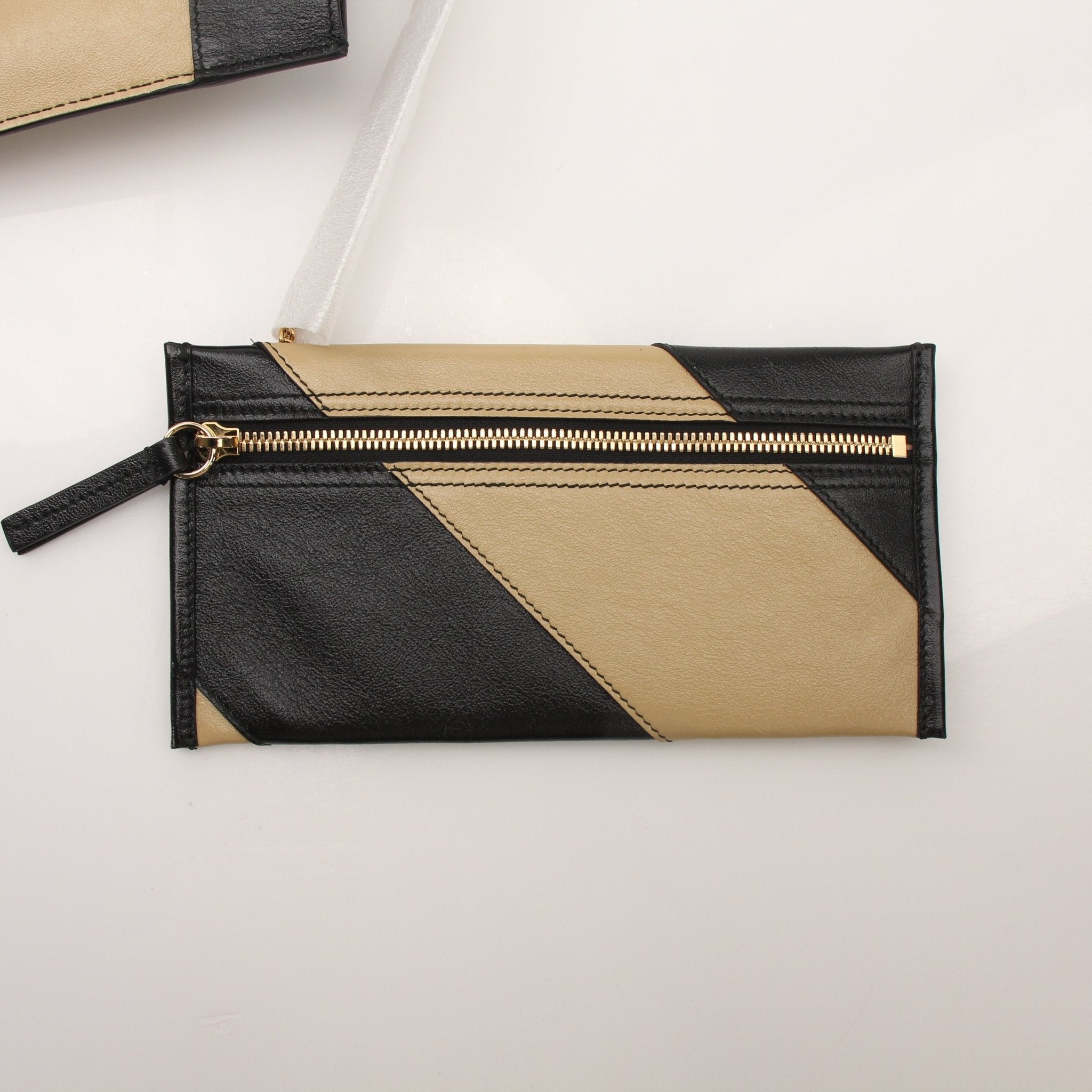 Gold & Beyond Gucci Zumi tote bag, stylish leather handbag with gold accents, featuring a spacious interior and dual top handles.
