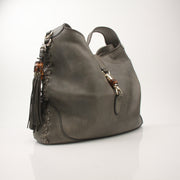 Gucci pebbled calfskin Jackie shoulder handbag with gold hardware, featuring a structured design and adjustable shoulder strap.
