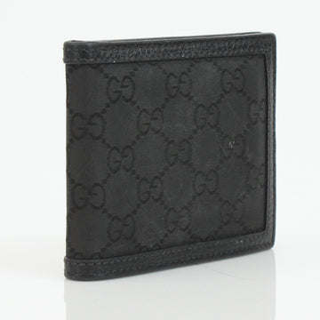 Gucci bifold wallet featuring GG nylon and leather, showcasing a sleek design and signature logo details.