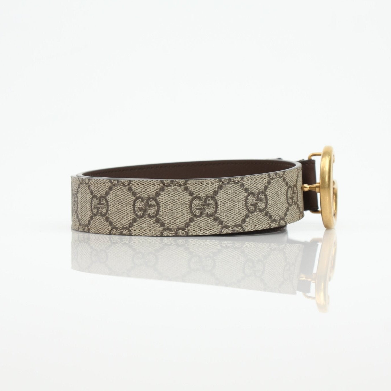 Gucci GG Supreme Double G Belt showing the signature monogram pattern and double G logo buckle on a stylish accessory.