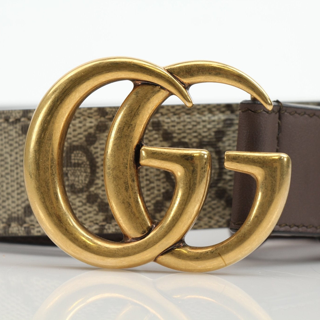 Gucci GG Supreme Double G belt with leather strap and metal buckle, stylish accessories for men and women.