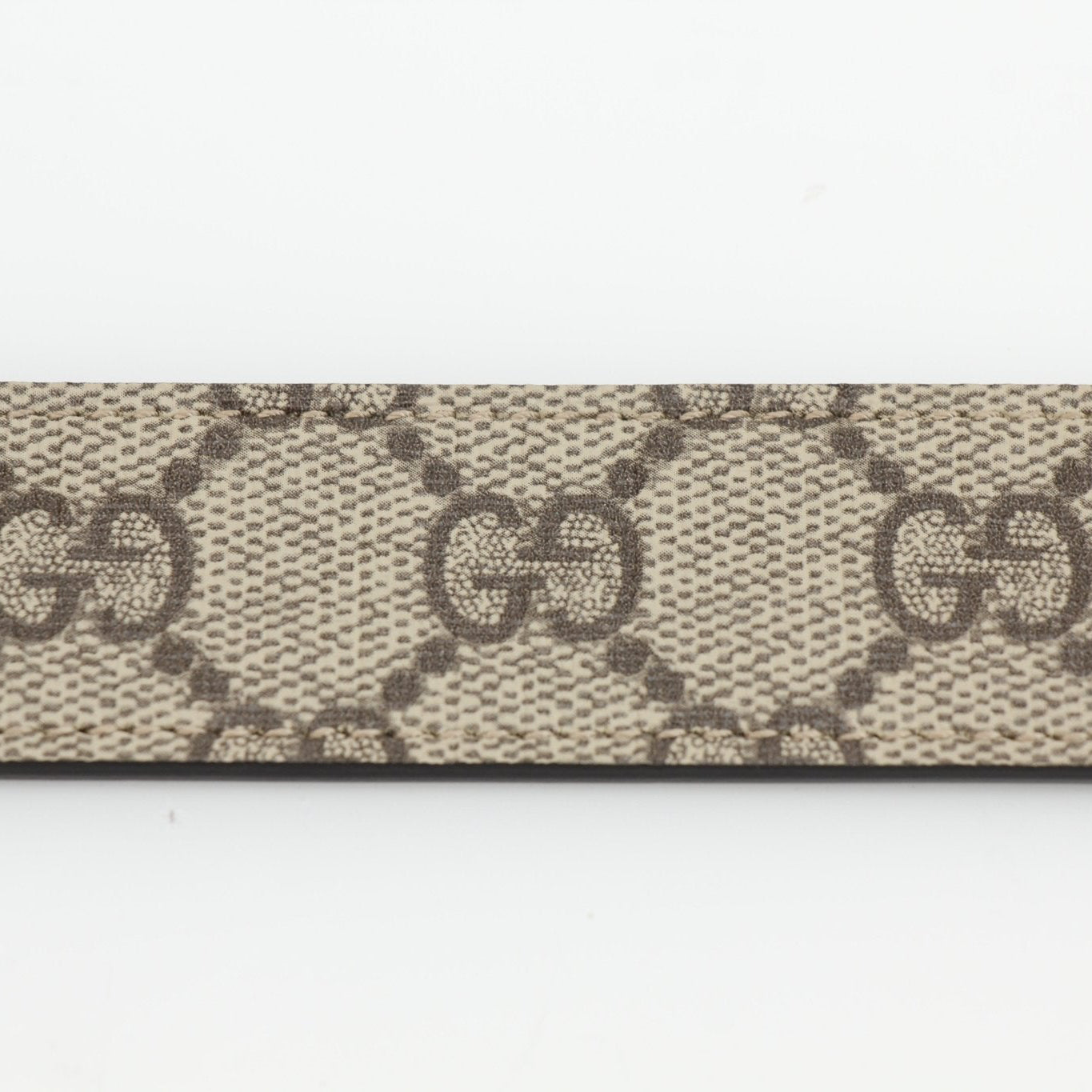 Gucci GG Supreme Double G belt featuring signature monogram canvas and gold-tone buckle, stylish accessories for men and women.