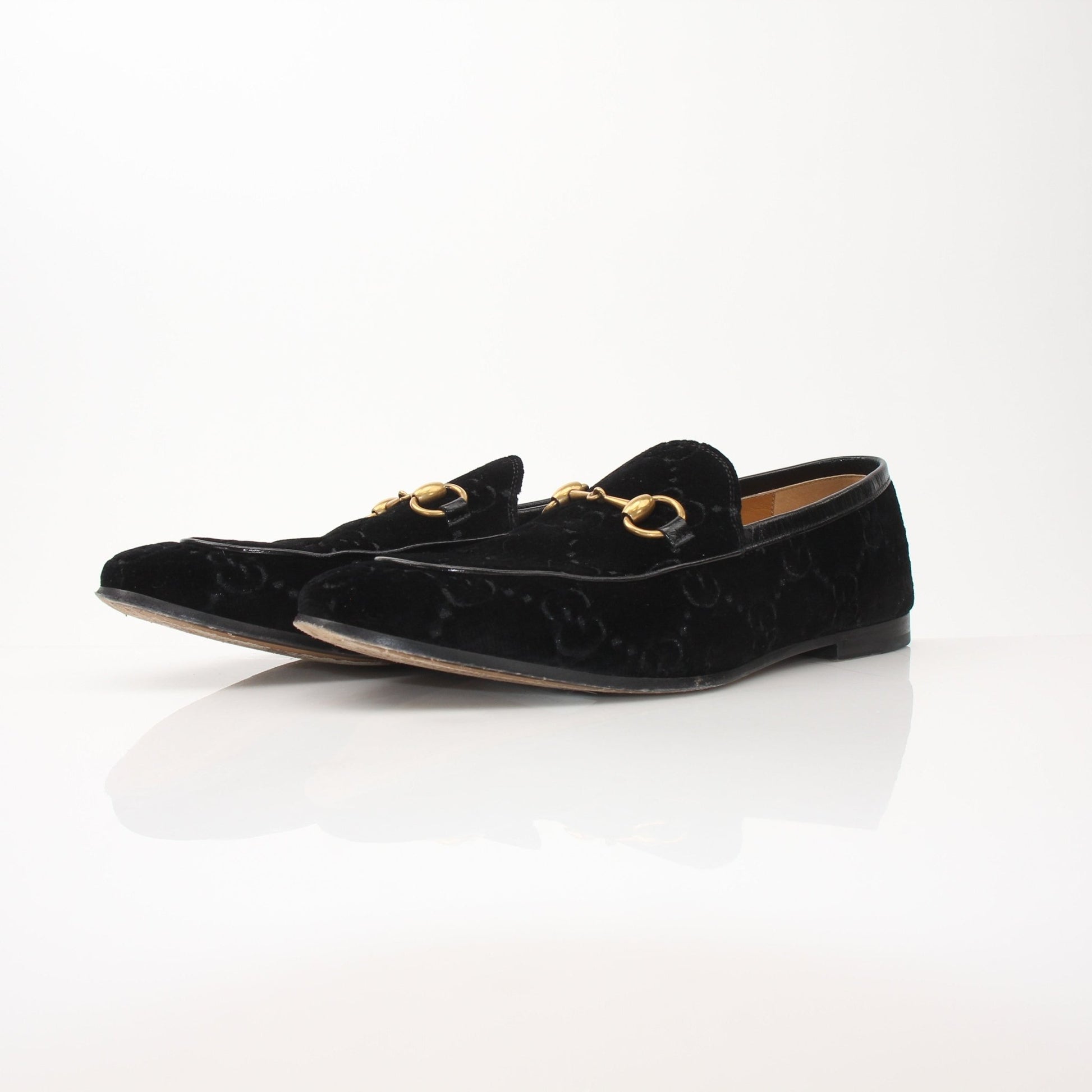 Gold & Beyond Gucci men’s Jordaan GG black velvet loafers, stylish slip-on shoes with signature branding and luxurious velvet material.