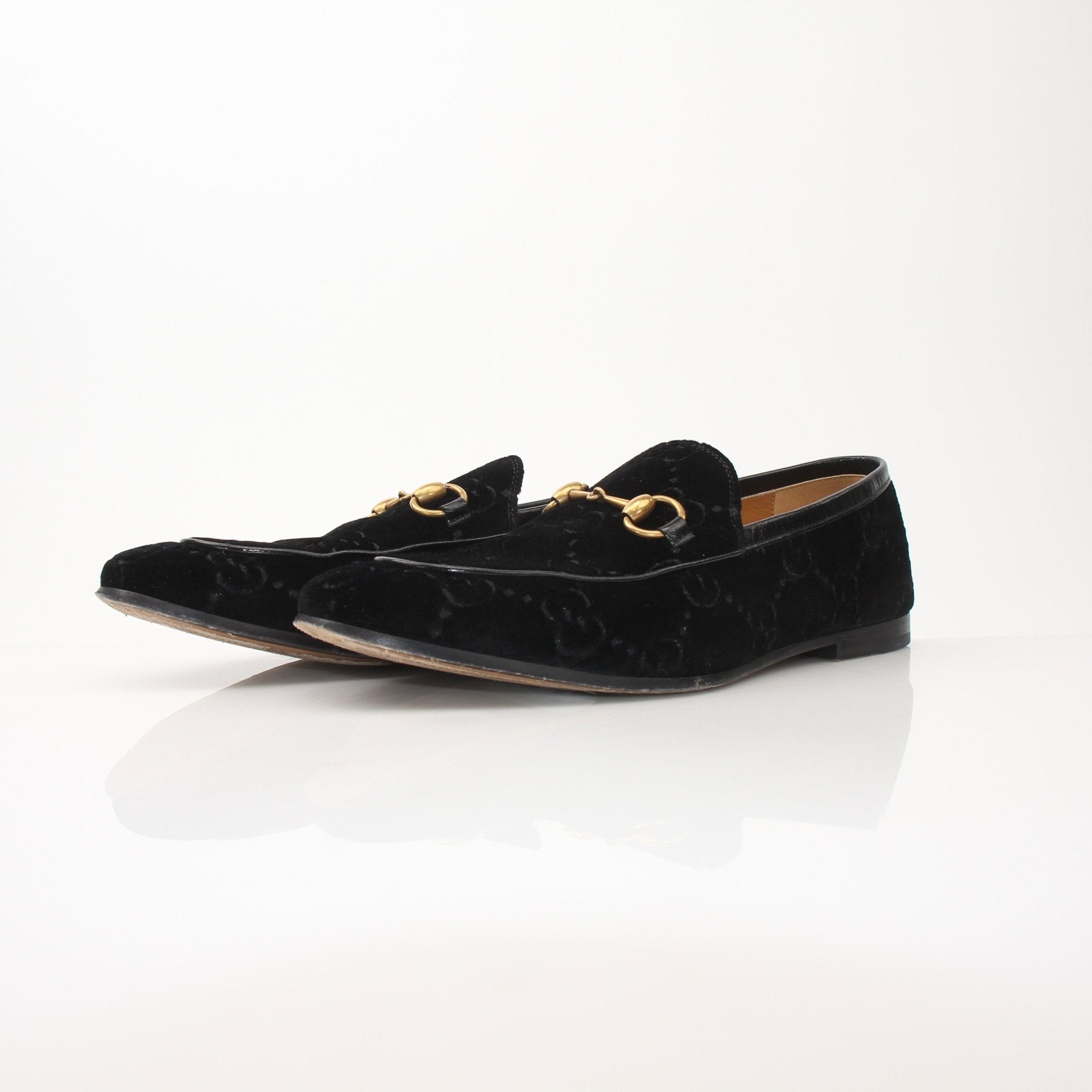 Gold & Beyond Gucci men’s Jordaan GG black velvet loafers, stylish slip-on shoes with signature branding and luxurious velvet material.