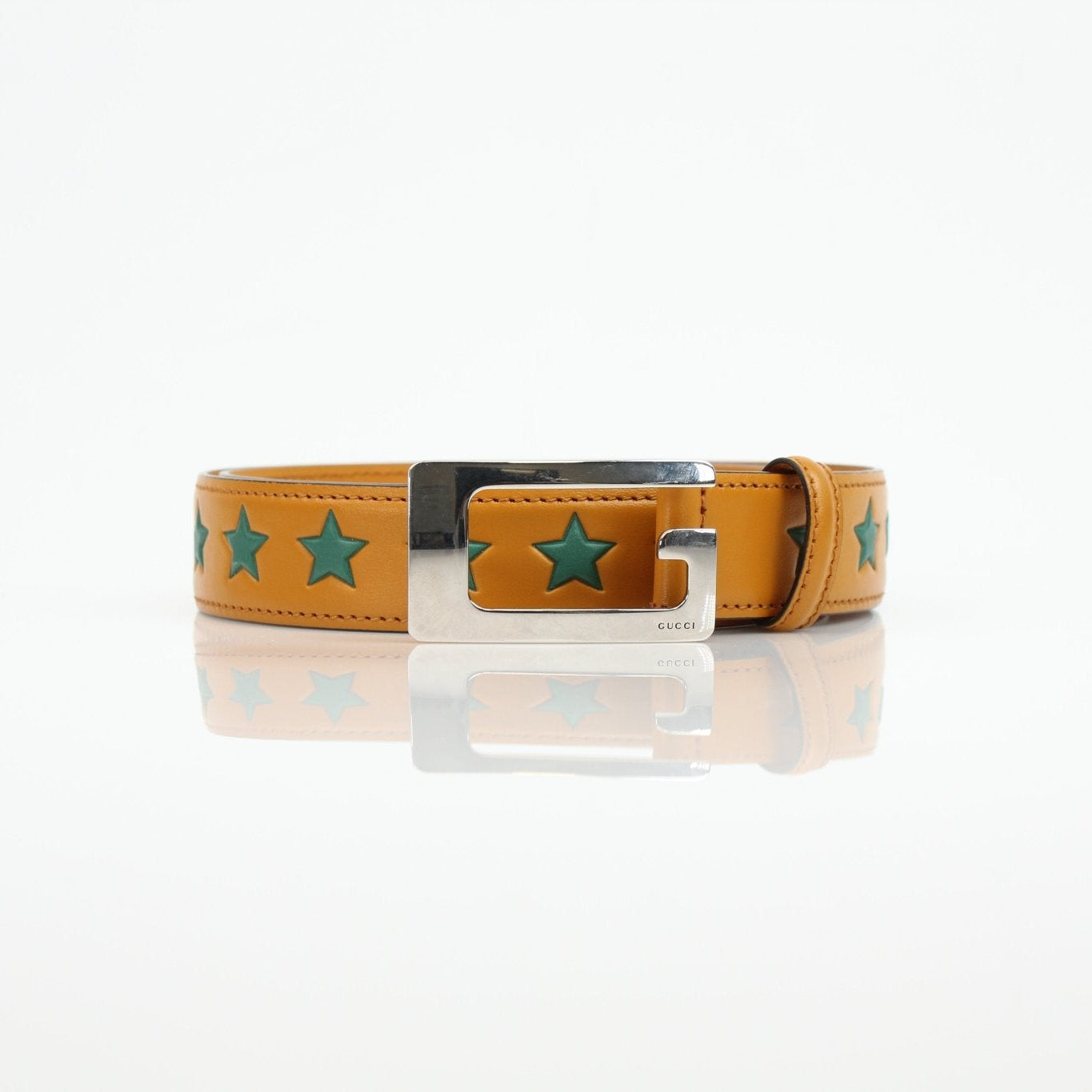 Gucci yellow star leather belt from Gold & Beyond accessories collection, featuring a star-shaped buckle and vibrant yellow leather strap.