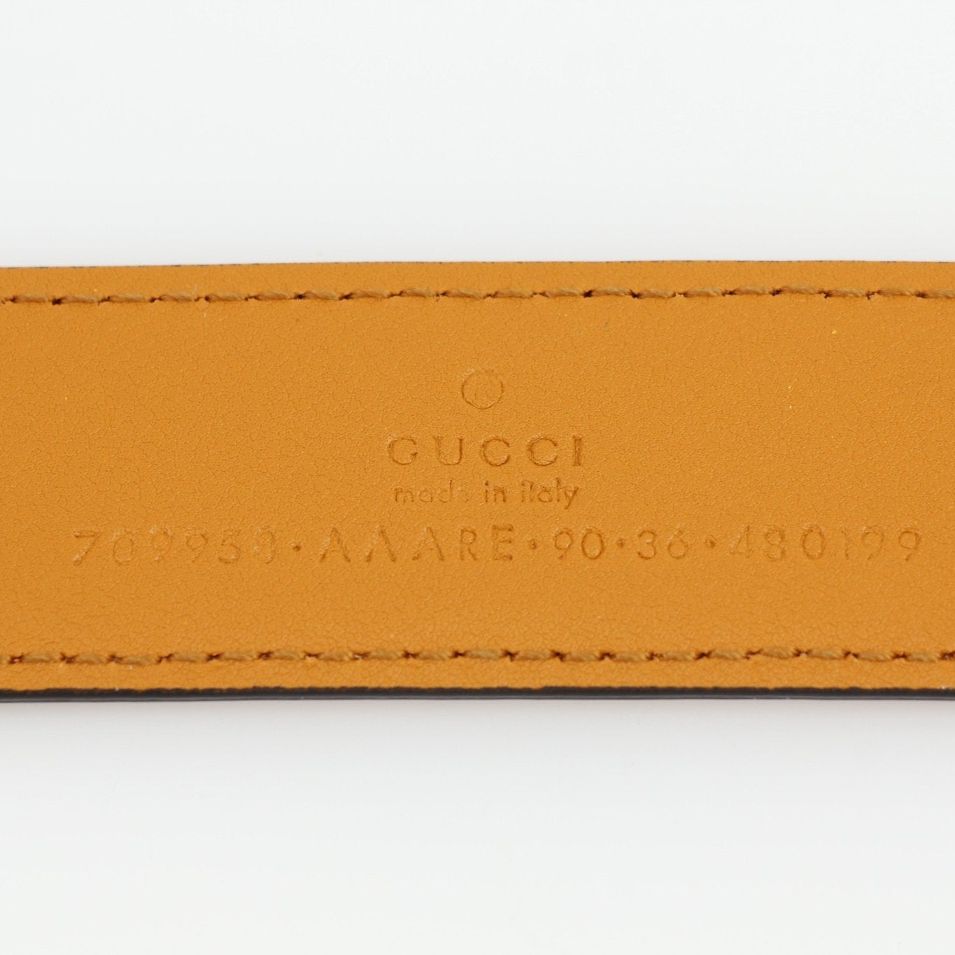 Gucci yellow star leather belt with gold buckle, stylish accessories for men and women, detailed close-up shot.