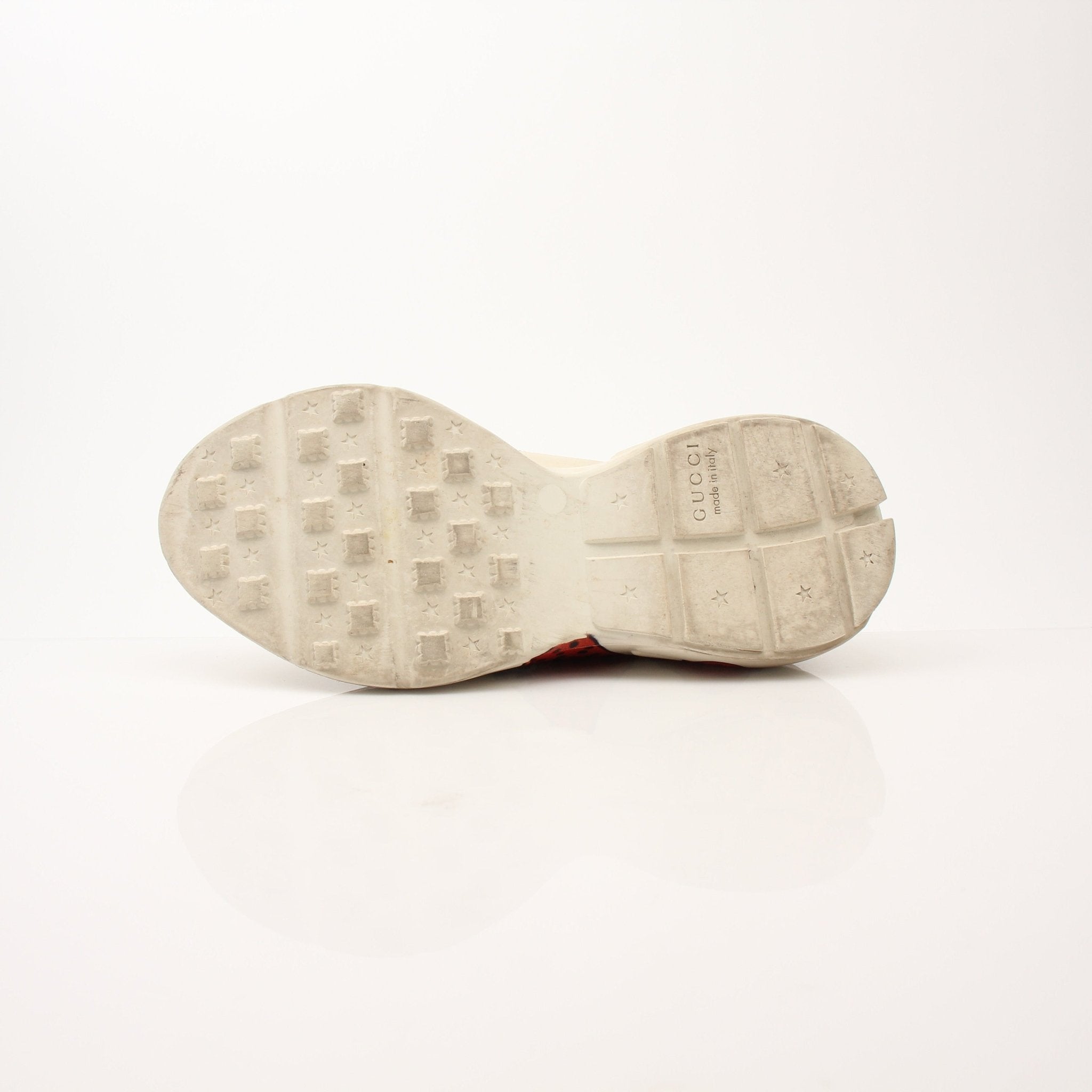 Gucci Women’s Rhyton Strawberry Sneakers featuring white leather, red strawberry design, and Gucci branding on the shoes.