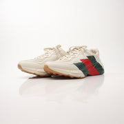 Gold & Beyond Gucci Men’s Rhyton Web Print Sneakers, stylish shoes with distinctive web print design and comfortable fit.