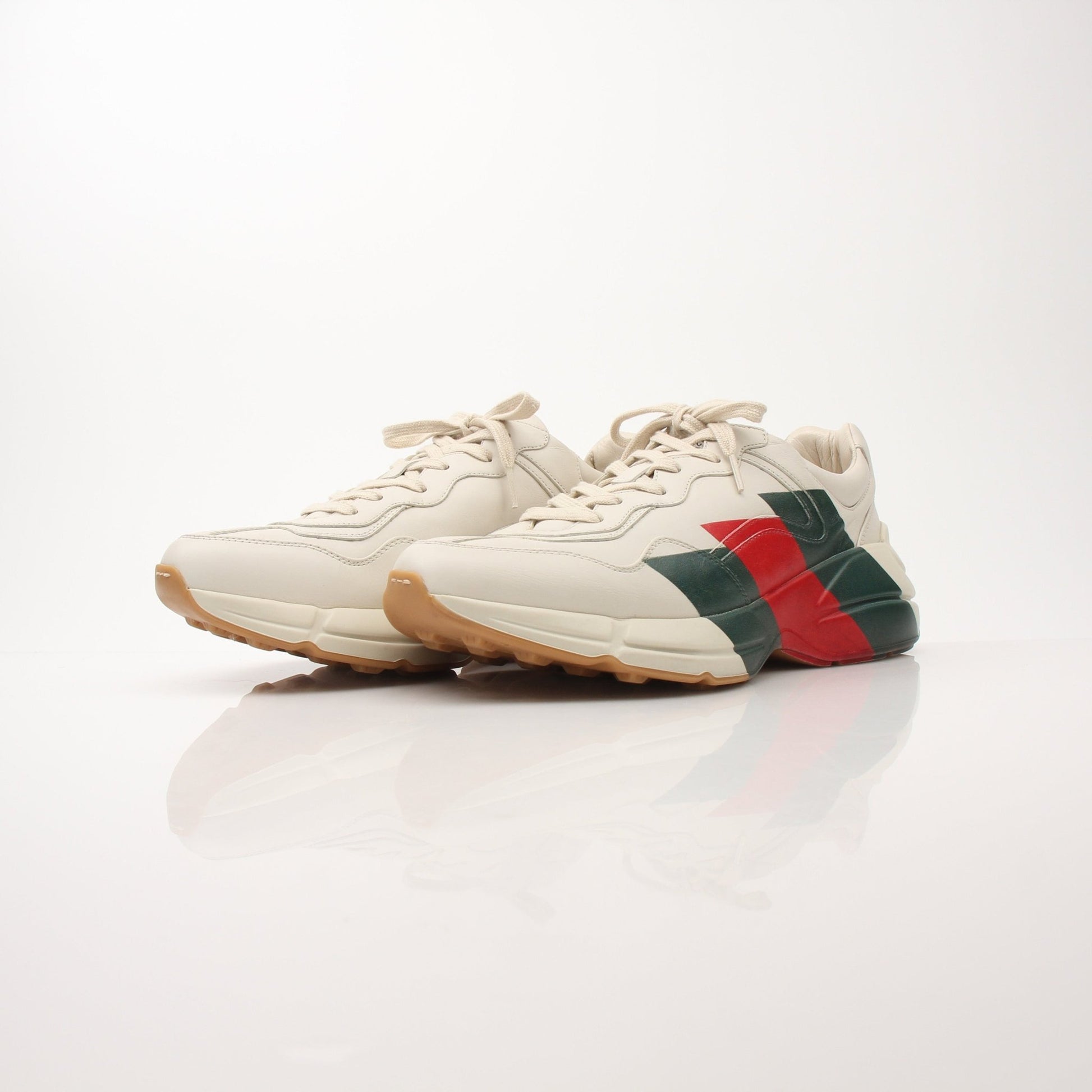 Gold & Beyond Gucci Men’s Rhyton Web Print Sneakers, stylish shoes with distinctive web print design and comfortable fit.