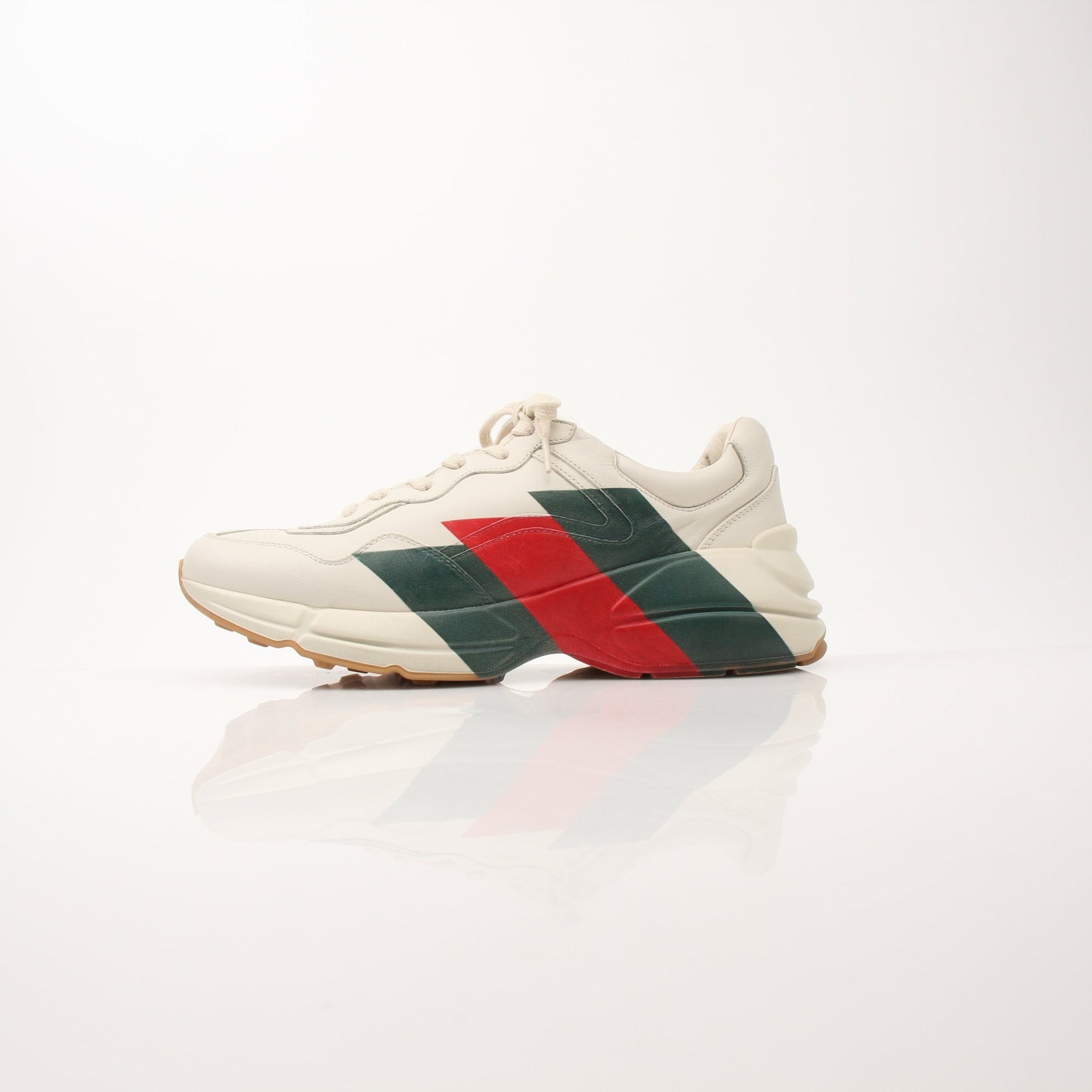 Gucci men's Rhyton Web Print sneakers in white with blue and red accents, casual shoe with signature branding.