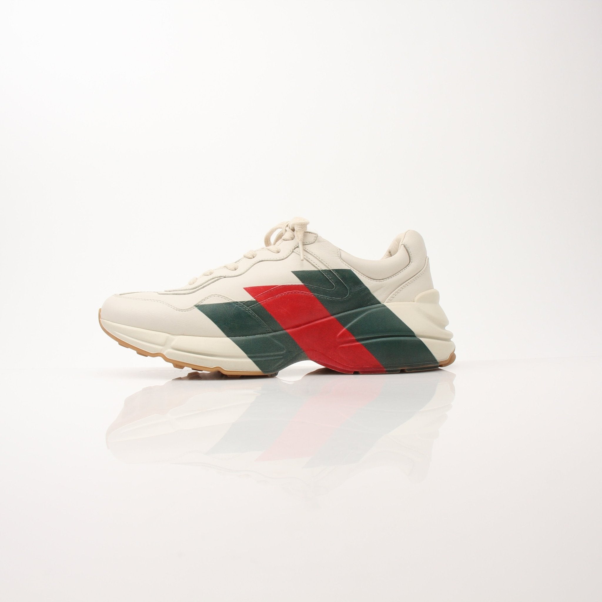 Gucci men's Rhyton Web Print sneakers in white with blue and red accents, casual shoe with signature branding.