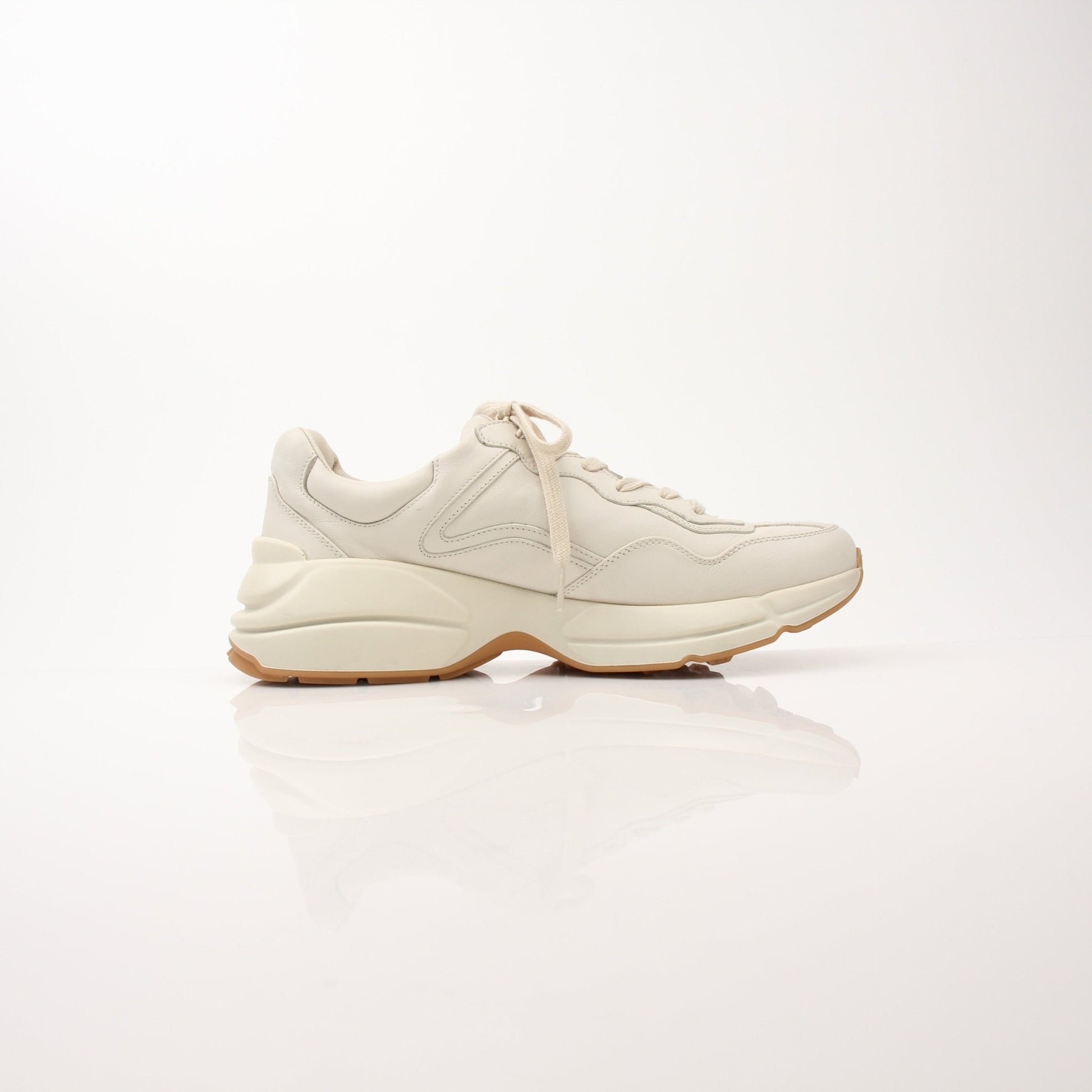 Gucci Men’s Rhyton Web Print Sneakers featuring classic design, white soles, and signature web print accents.