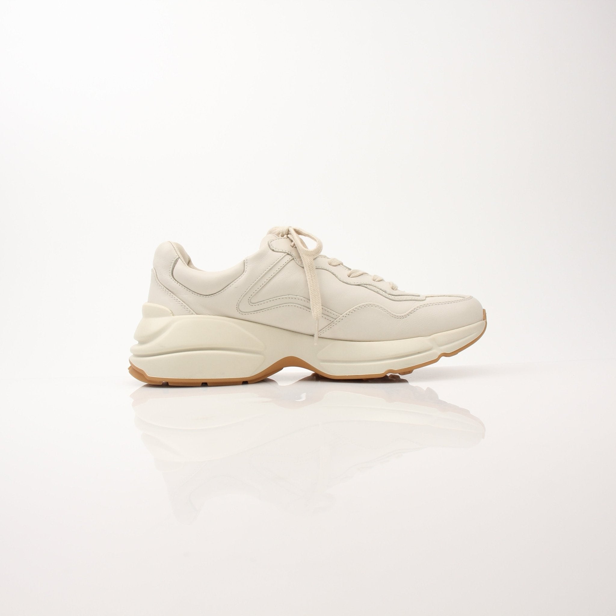 Gucci Men’s Rhyton Web Print Sneakers featuring classic design, white soles, and signature web print accents.