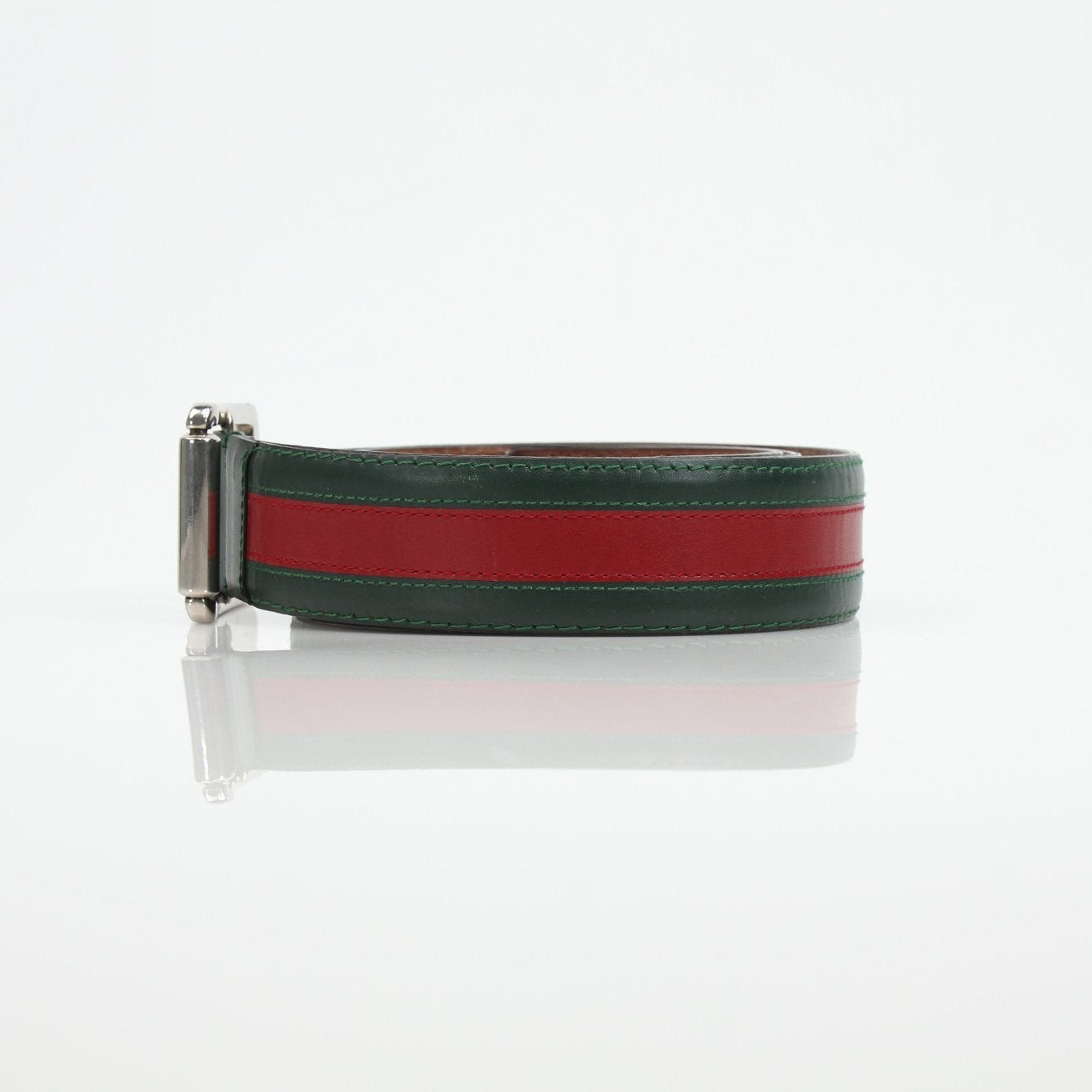 Gucci red and green web belt featuring the iconic striped design, made of durable fabric with a metal buckle.