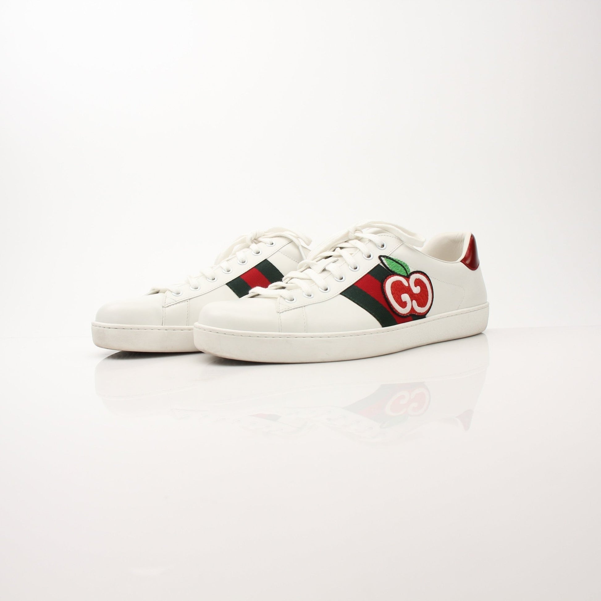 Gold & Beyond Gucci men's GG Apple sneakers, stylish shoes with signature pattern and comfortable design, close-up view.