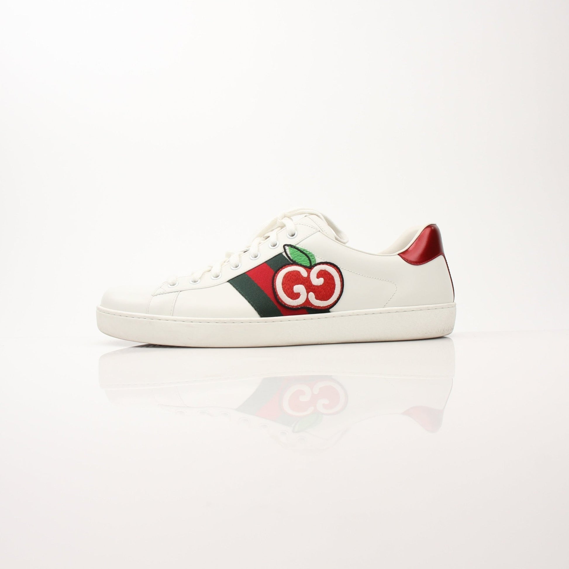 Gucci Men’s GG Apple Sneakers by Gold & Beyond, stylish shoes with Gucci logo and green-red-green stripe details.