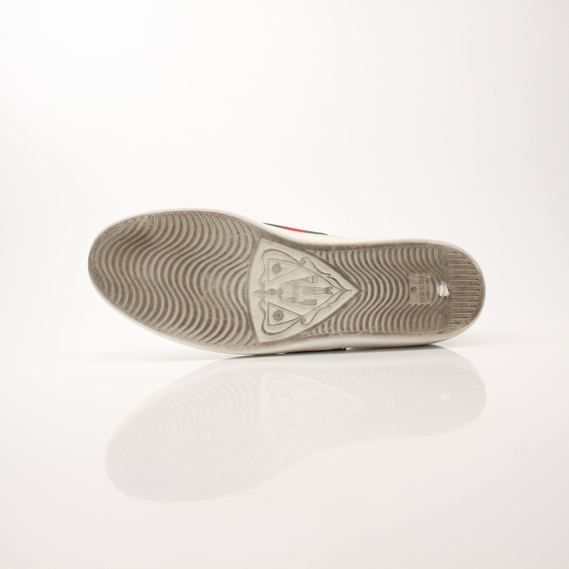 Gucci Men’s GG Apple Sneakers by Gold & Beyond, stylish shoes with Gucci logo and vibrant green and red accents on white sneakers.