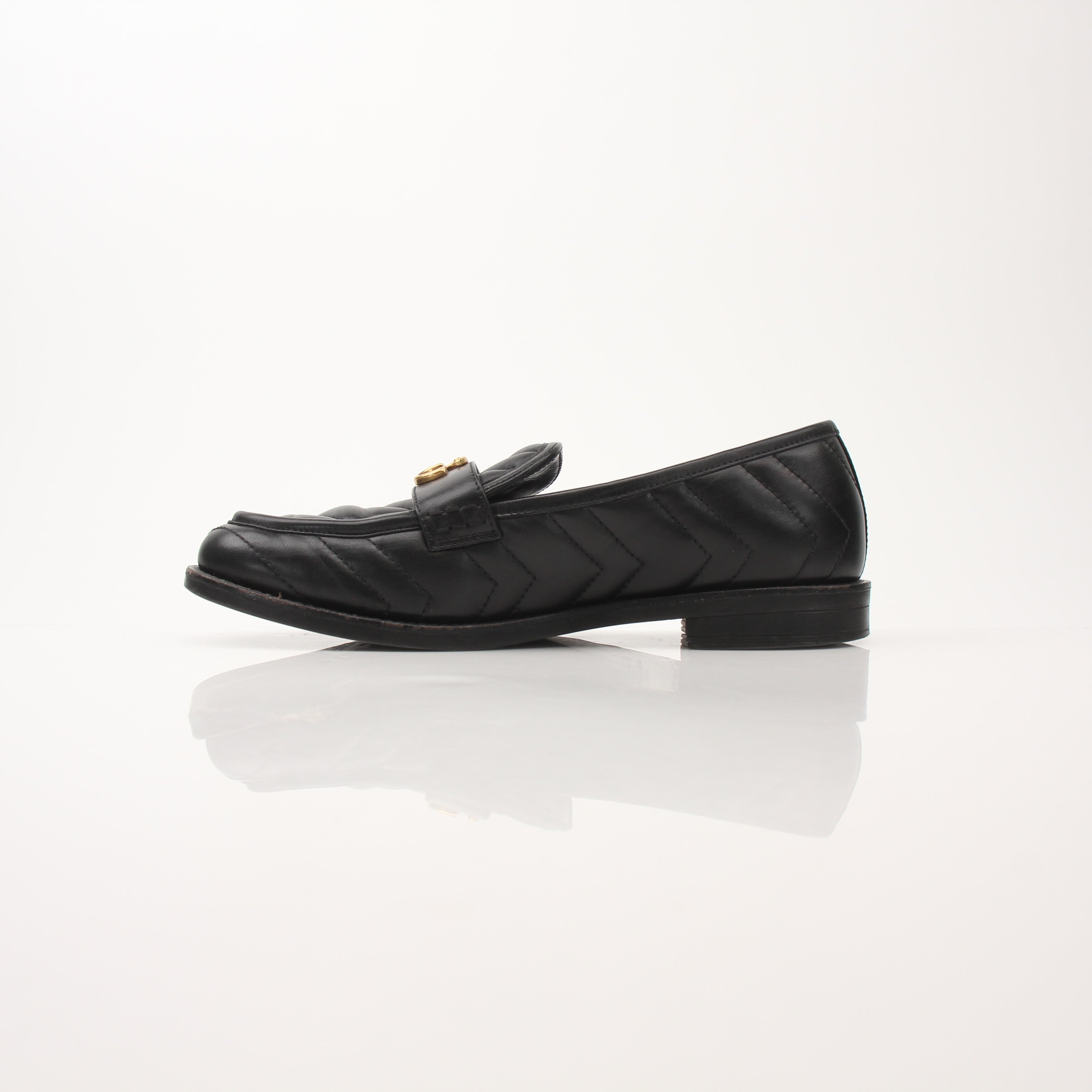 Gold & Beyond Gucci women’s double G loafers shoes featuring classic design and leather material.