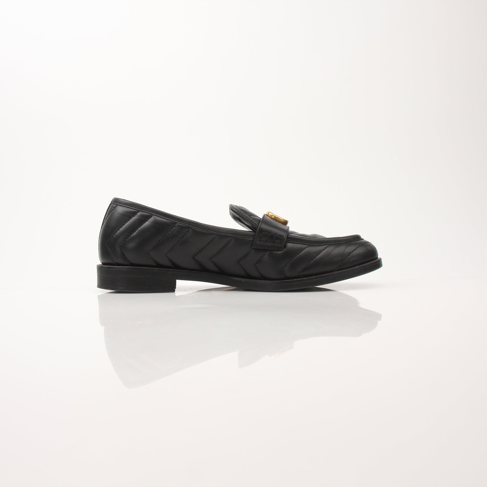 Gold & Beyond Gucci women's Double G loafers, stylish leather shoes with signature logo details and classic slip-on design.