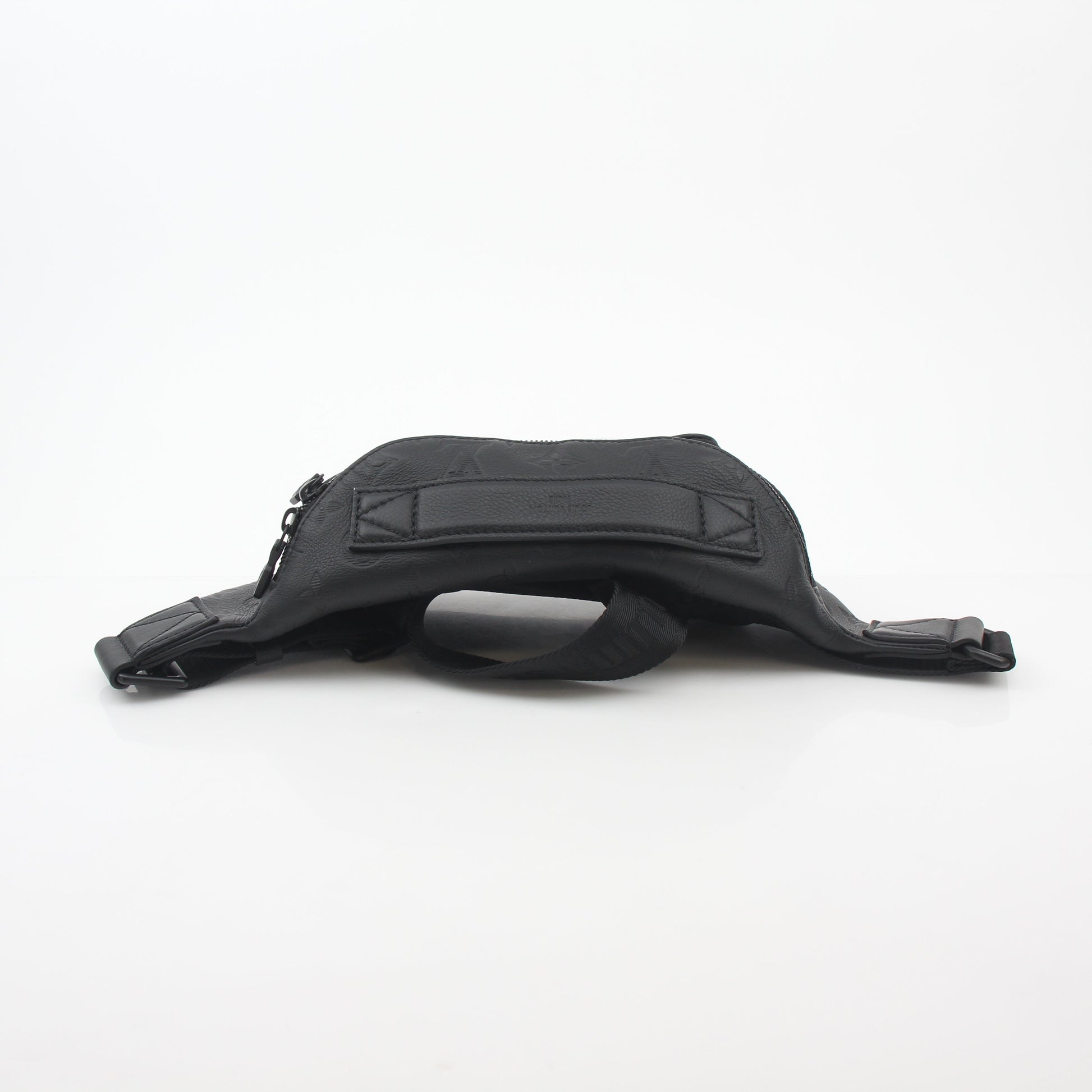 Louis Vuitton Black Monogram Shadow Rush Bum Bag, stylish handbag with monogram pattern and adjustable strap, on a neutral background.