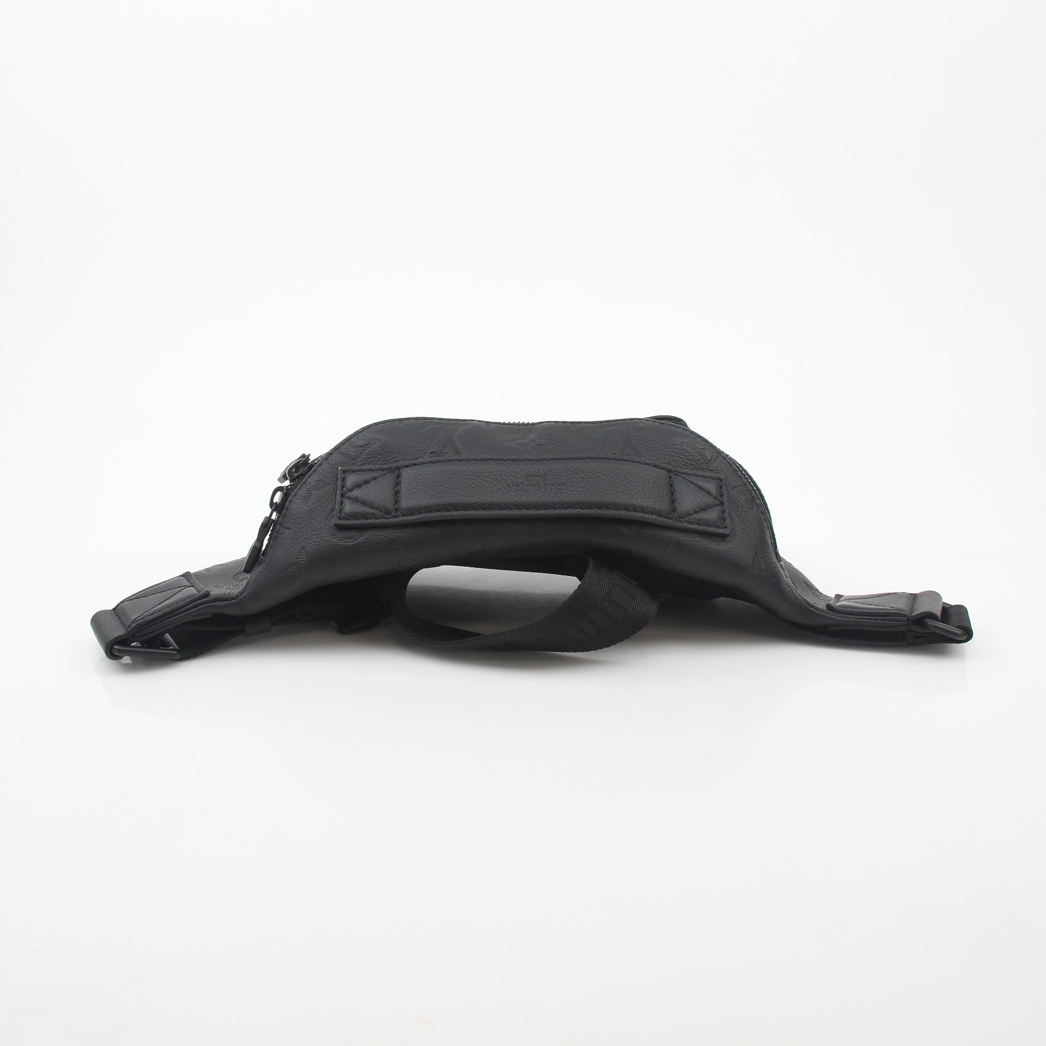 Louis Vuitton Black Monogram Shadow Rush Bum Bag, stylish handbag with monogram pattern and adjustable strap, on a neutral background.