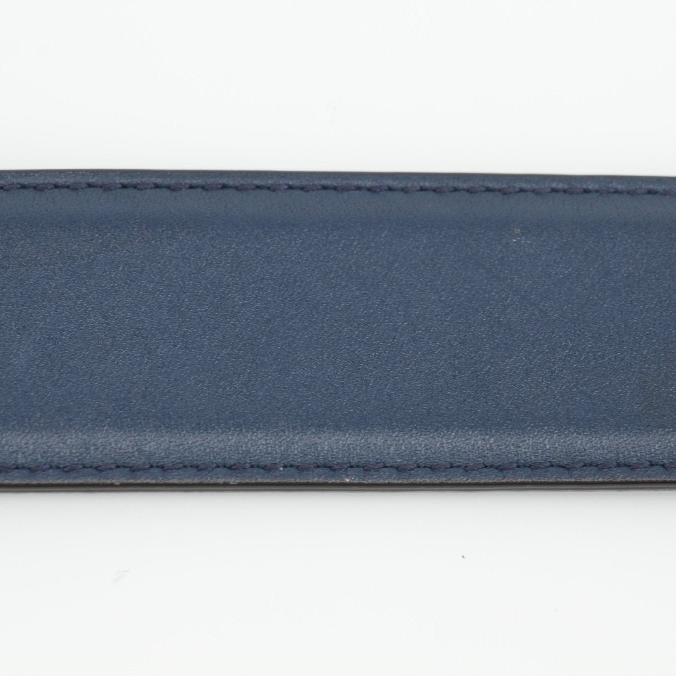 Gucci navy interlocking GG belt with gold buckle, stylish accessories for men and women.