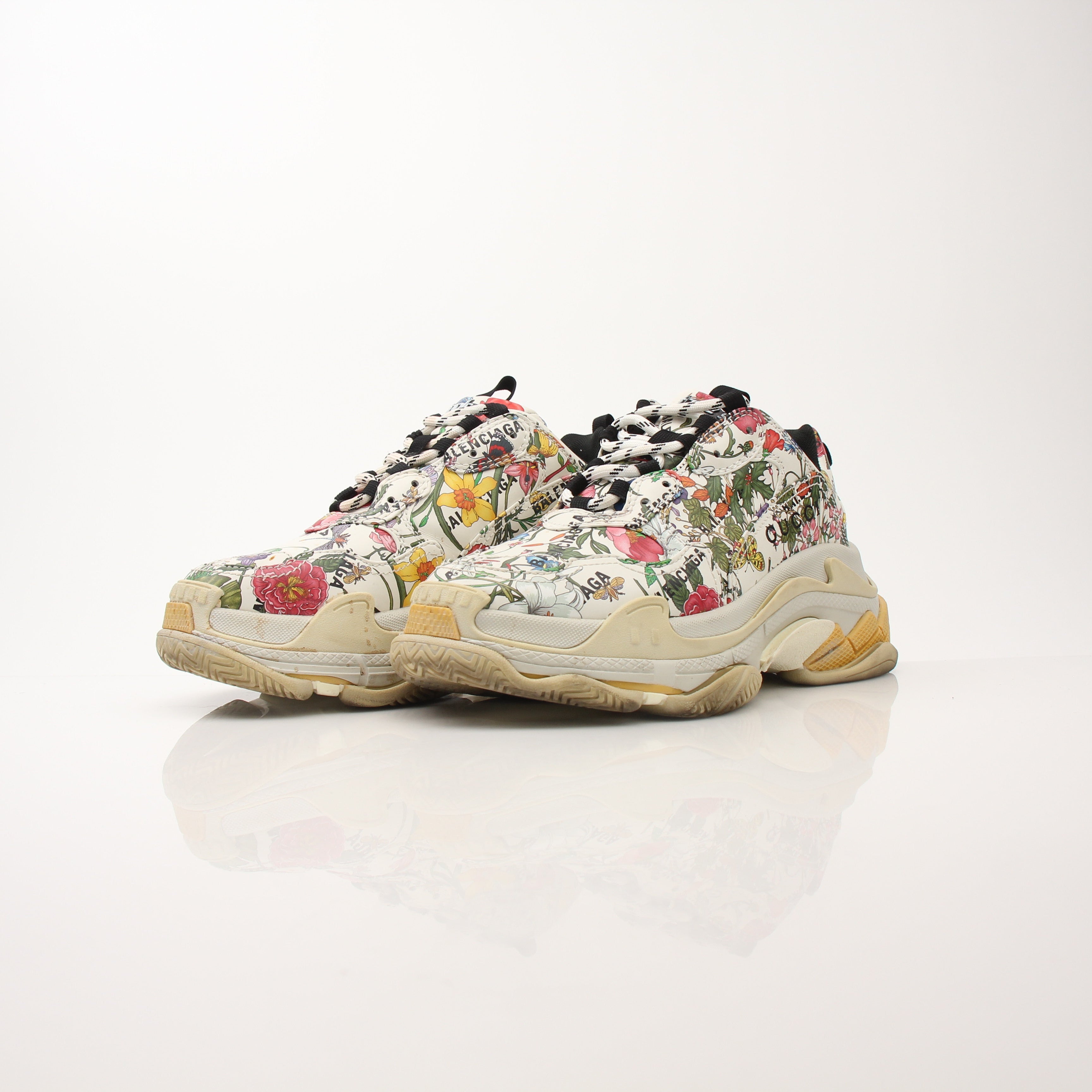 Gold & Beyond Gucci x Balenciaga The Hacker Project Triple S sneakers, stylish multi-color shoes with chunky design.