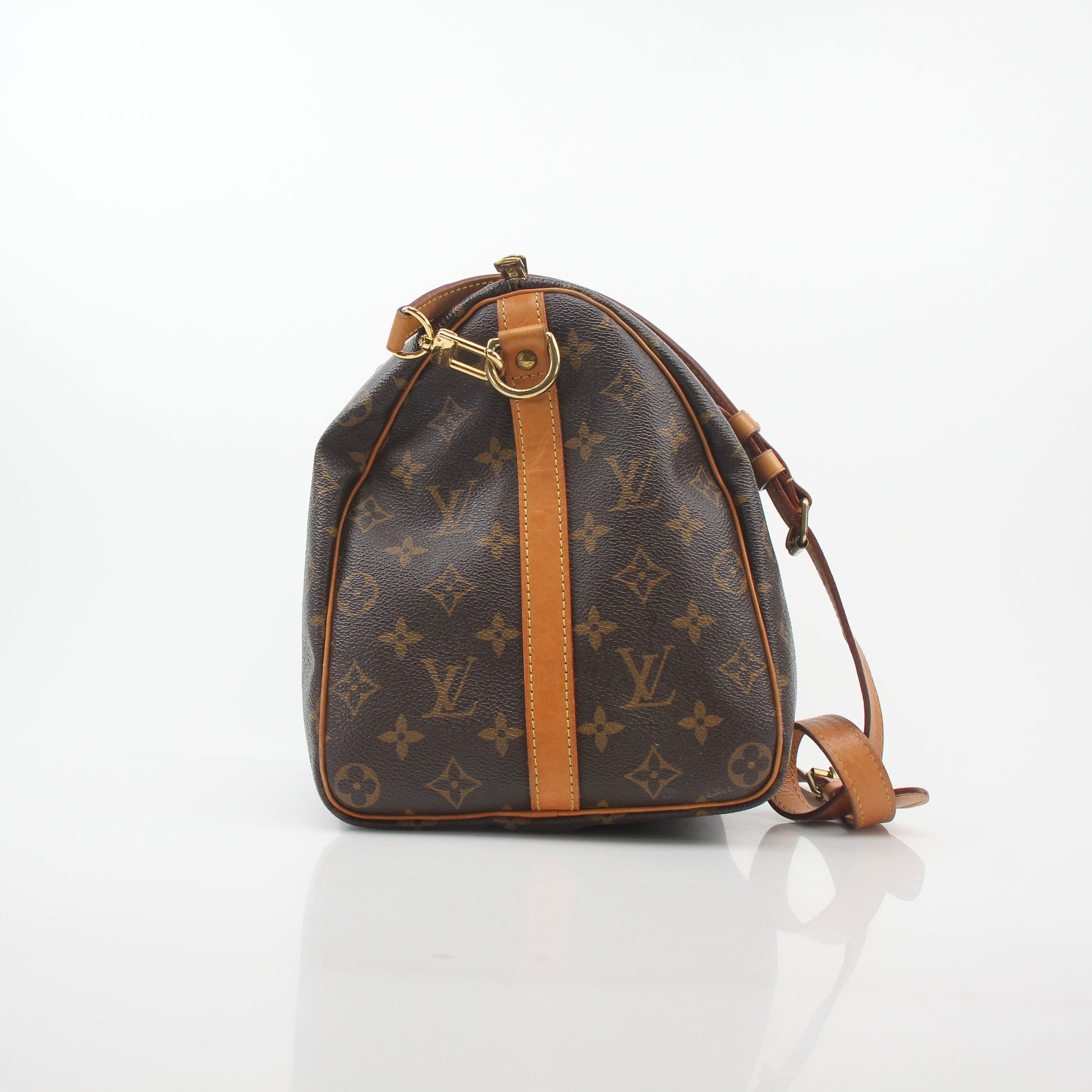 Louis Vuitton Monogram Speedy Bandoulière 35 handbag with gold hardware and leather handle, showcasing signature monogram canvas.
