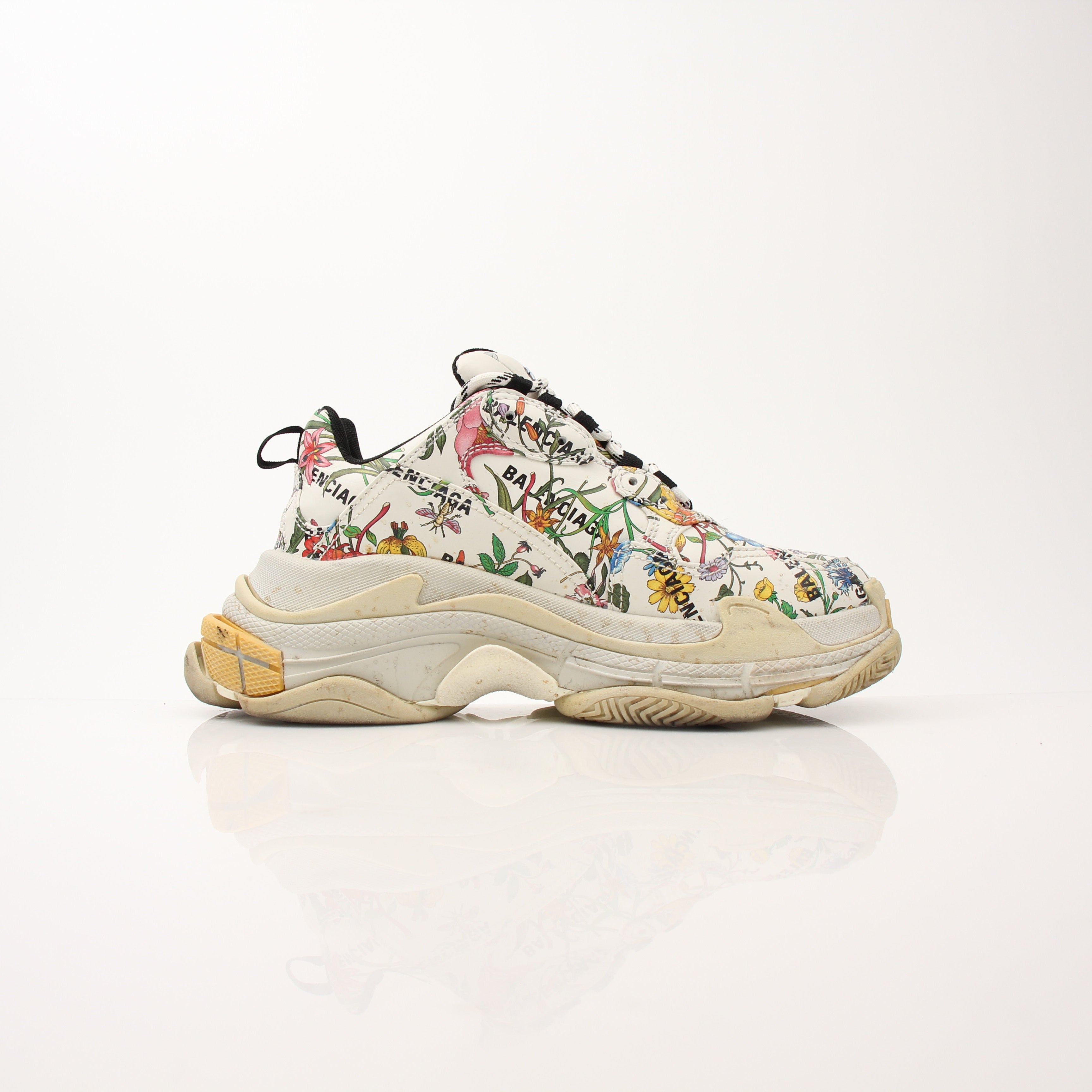 Gold & Beyond Gucci x Balenciaga The Hacker Project Triple S sneakers with multi-color design and chunky sole, front view.