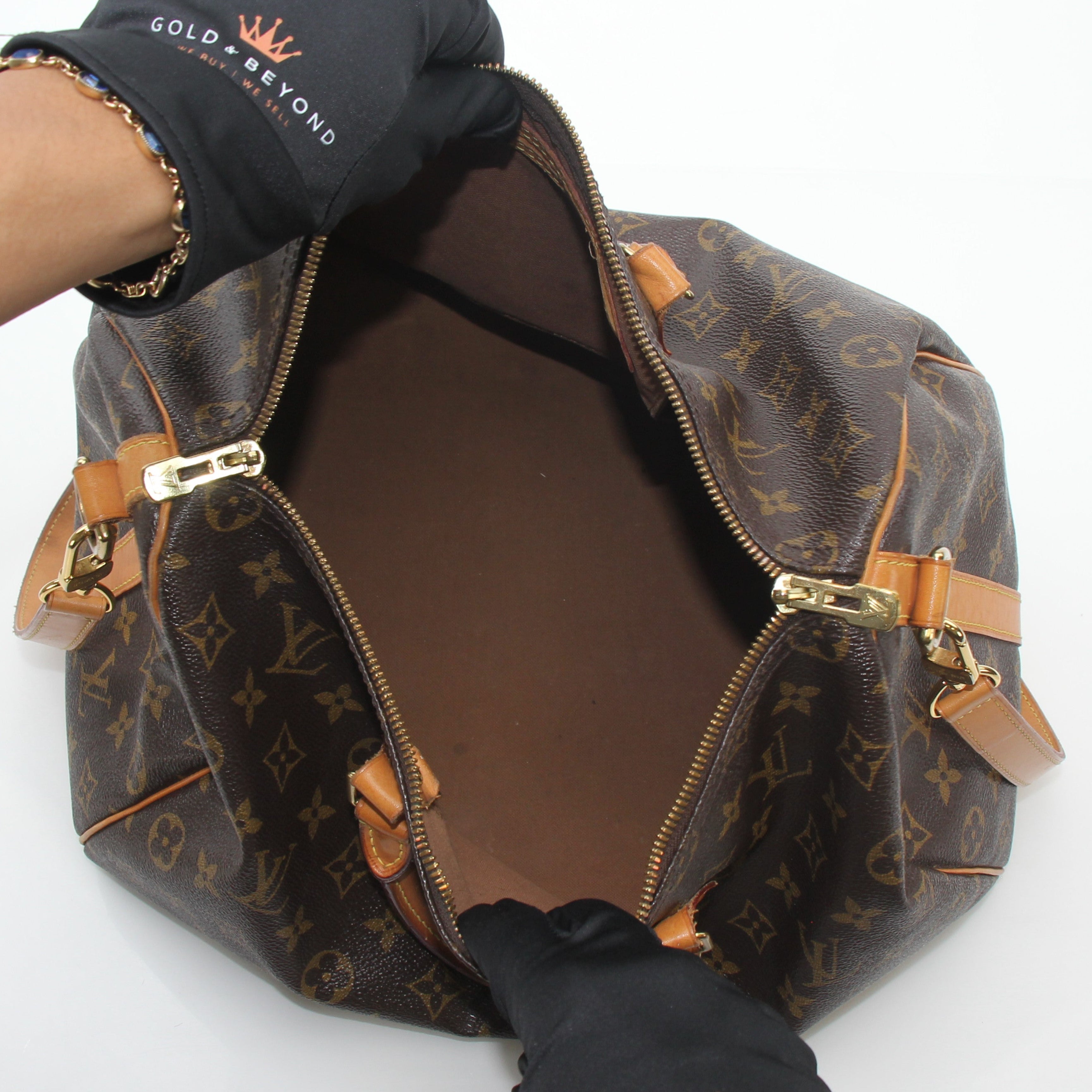 Louis Vuitton Monogram Speedy Bandoulière 35 handbag with leather trim and gold hardware, displayed on a plain background