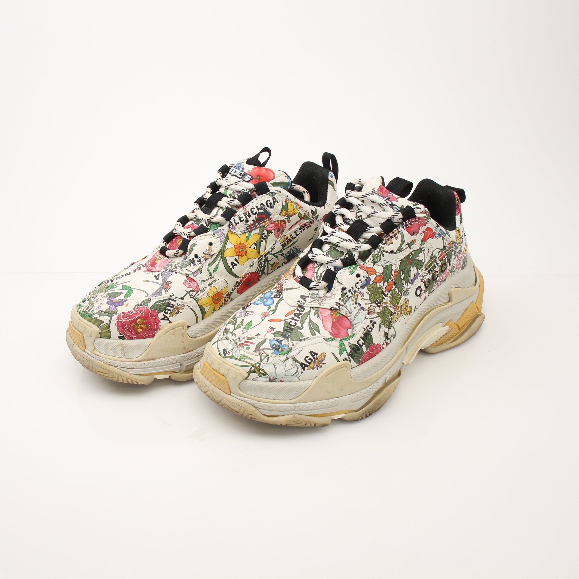 Gold & Beyond Gucci x Balenciaga The Hacker Project Triple S sneakers, featuring layered design and bold branding details.