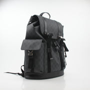 Gucci Black GG Supreme Lark Backpack with leather straps and gold-tone hardware, ideal for travel and daily use.