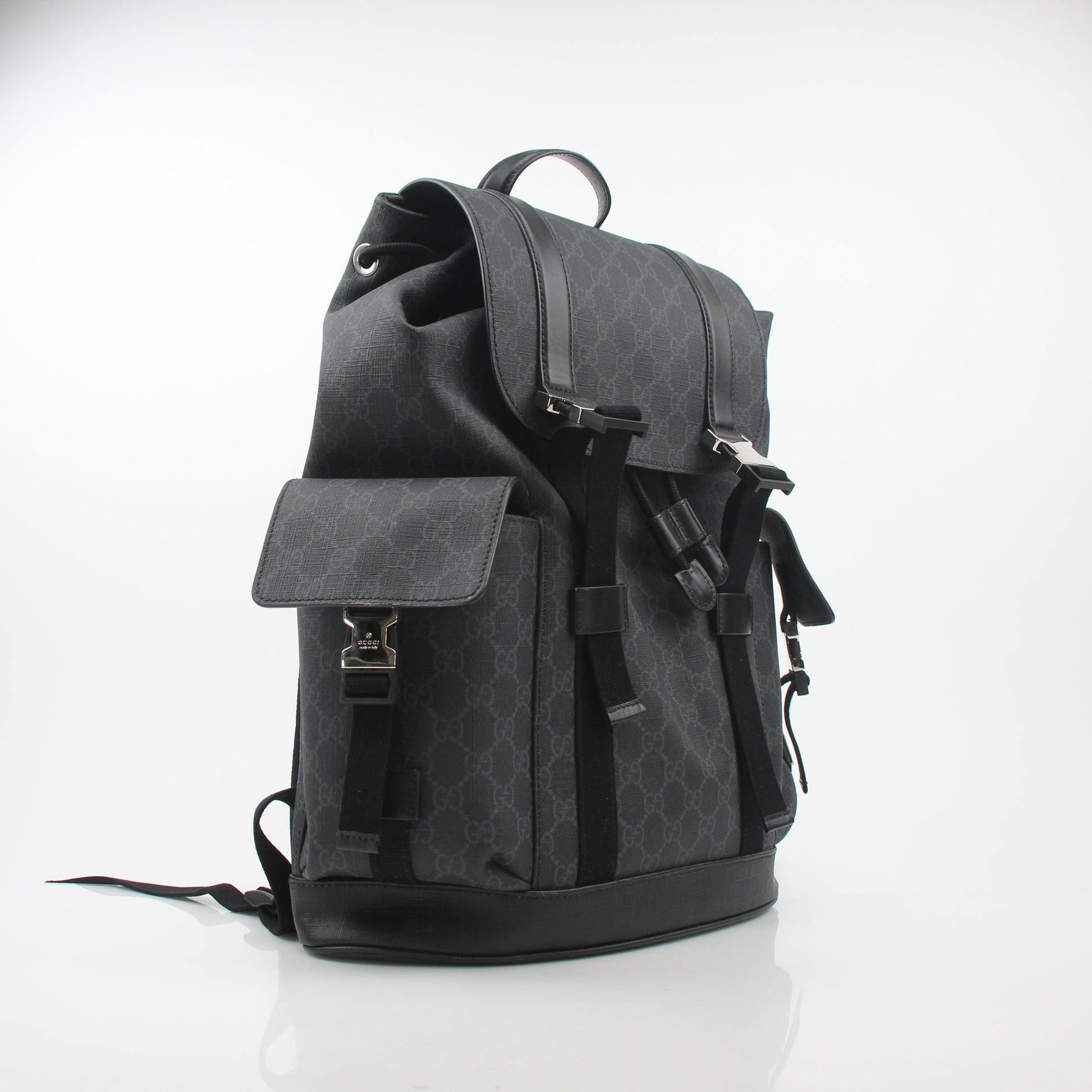 Gucci Black GG Supreme Lark Backpack with leather straps and gold-tone hardware, ideal for travel and daily use.