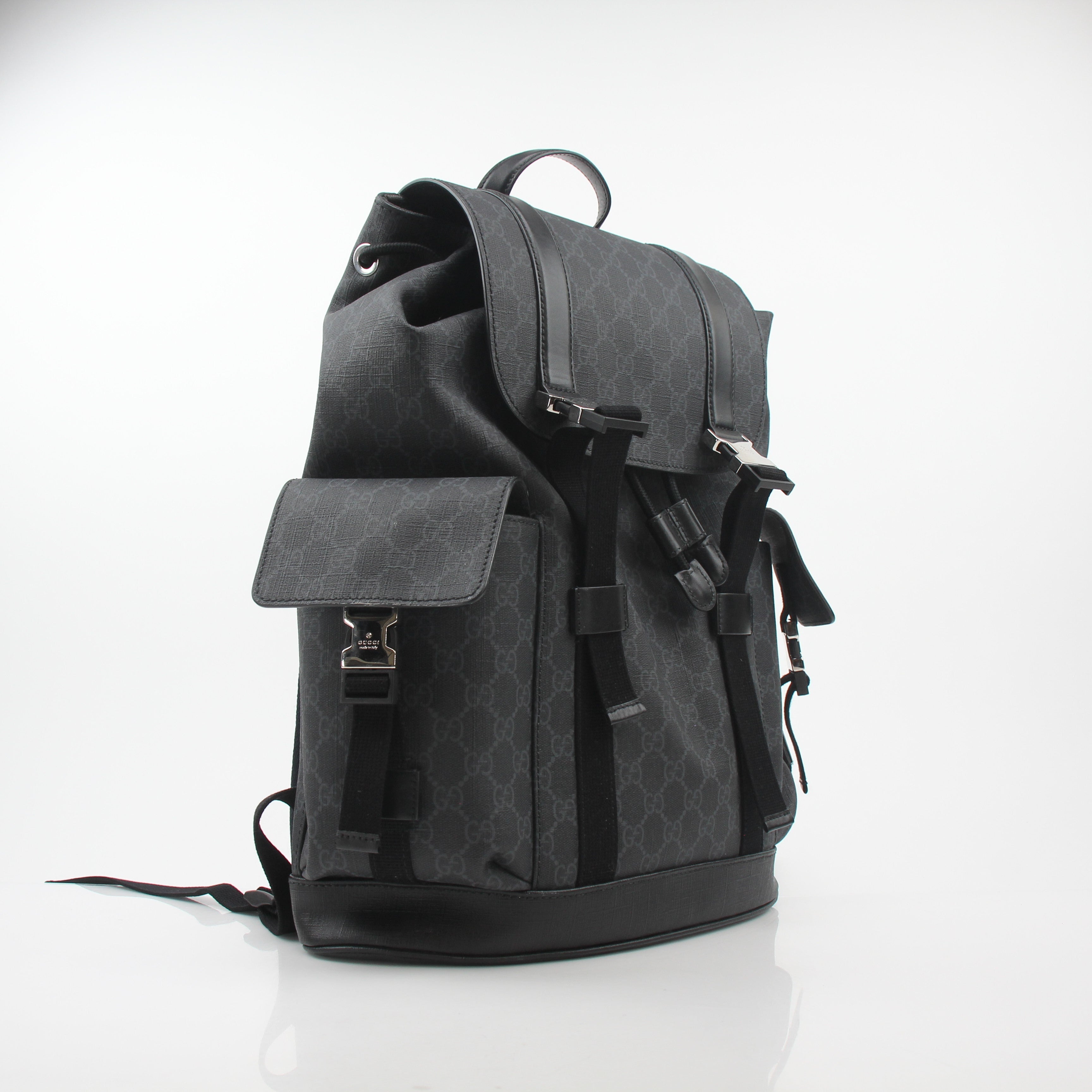 Gucci Black GG Supreme Lark Backpack with leather straps and gold-tone hardware, ideal for travel and daily use.
