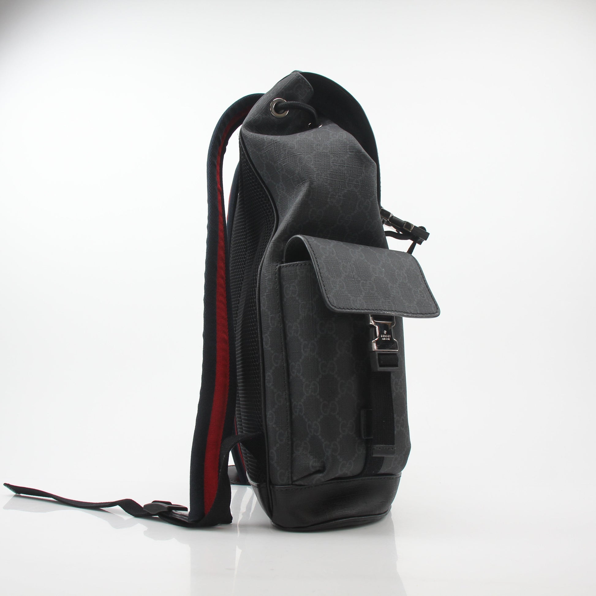 Gucci Black GG Supreme Lark Backpack for travel, featuring signature monogram design and adjustable straps.