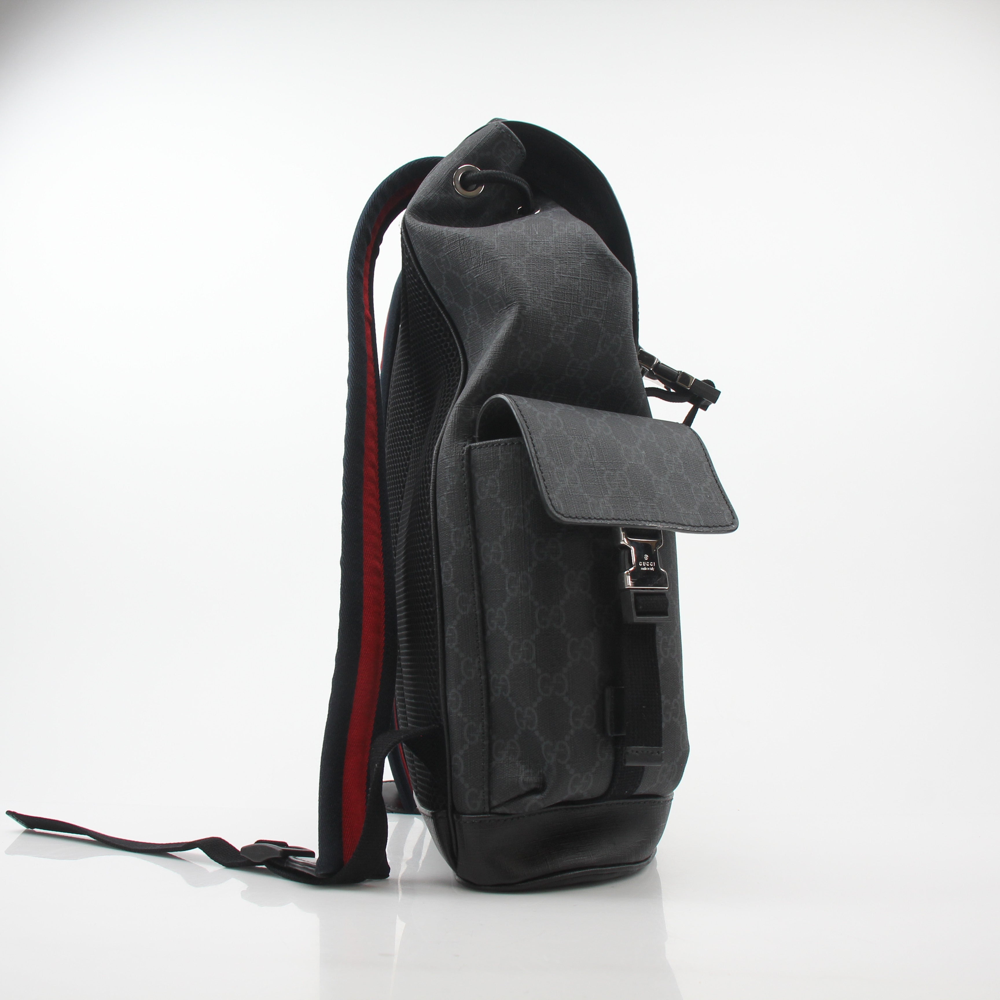 Gucci Black GG Supreme Lark Backpack for travel, featuring signature monogram design and adjustable straps.