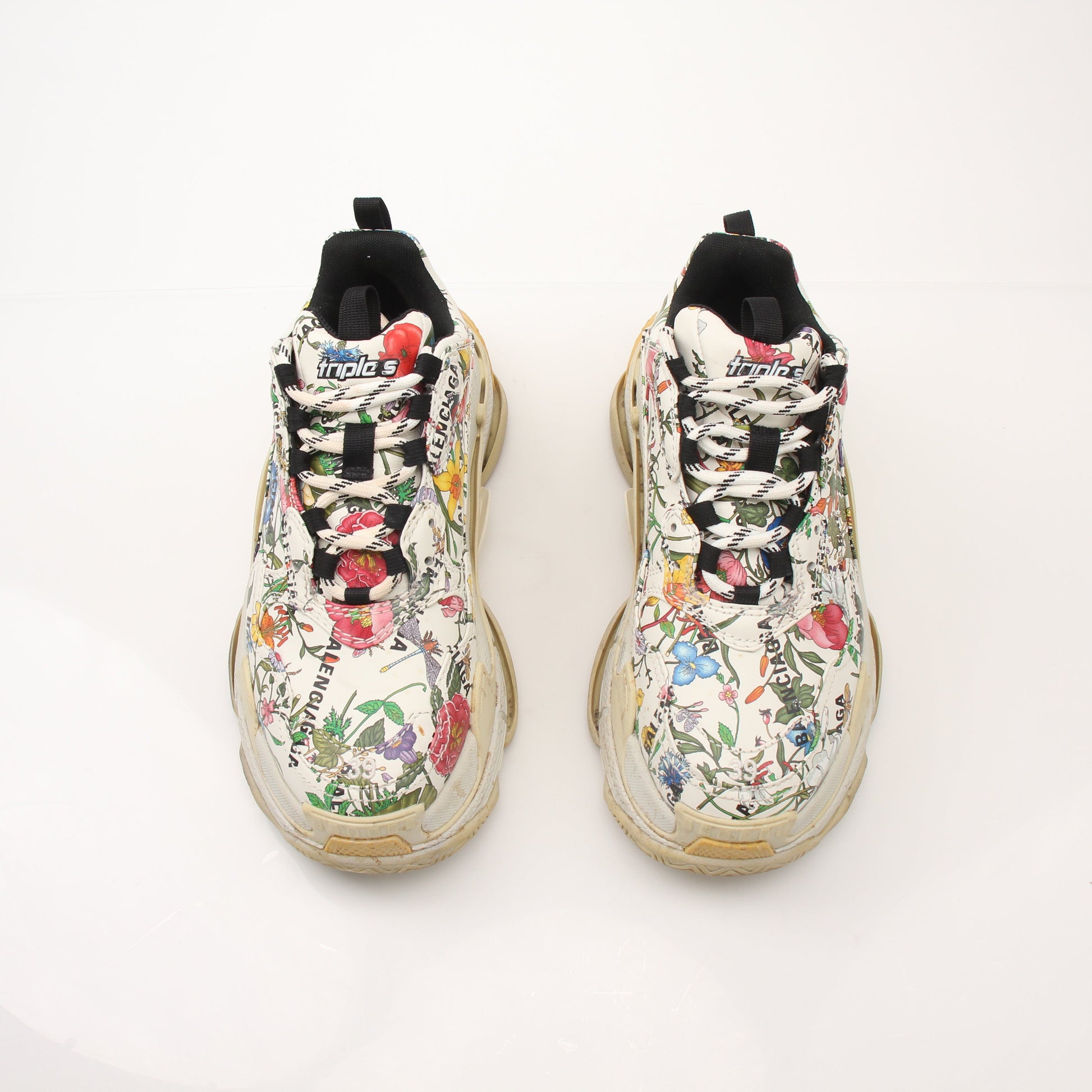 Gucci x Balenciaga The Hacker Project Triple S Sneakers in gold and black, featuring chunky design and mixed brand logos.