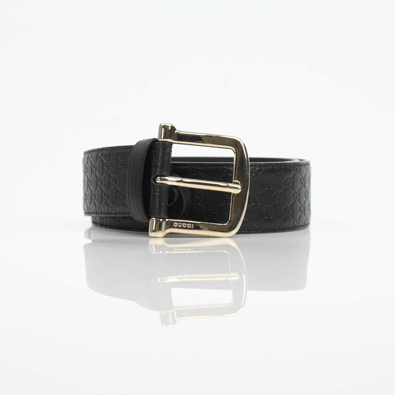 Black Gucci Guccissima belt with gold buckle, showcasing the iconic pattern and sleek design, perfect for stylish accessories.