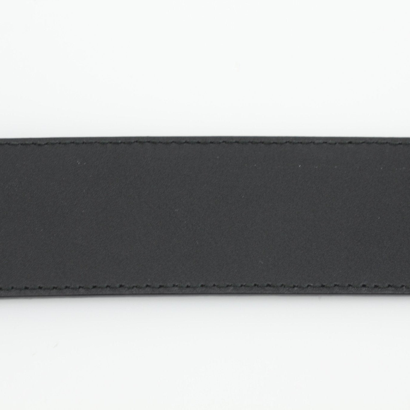 Gucci Black Guccissima belt with gold buckle, stylish accessories for men and women, featuring signature monogram pattern.