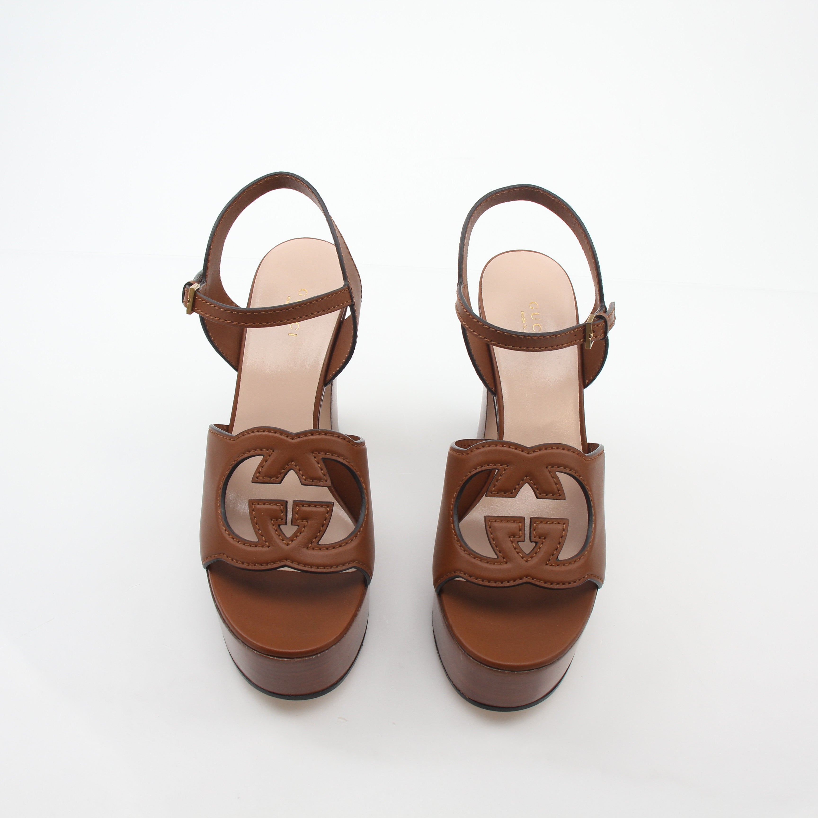 Gold & Beyond Gucci brown interlocking G cut-out platform heels with strappy design and chunky soles.