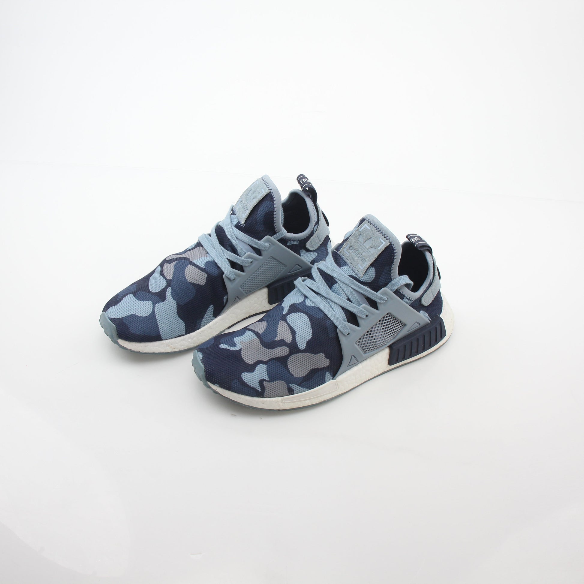 Adidas NMD XR1 PK Blue Duck Camo sneakers with boost soles and branded details, displayed on a white background.