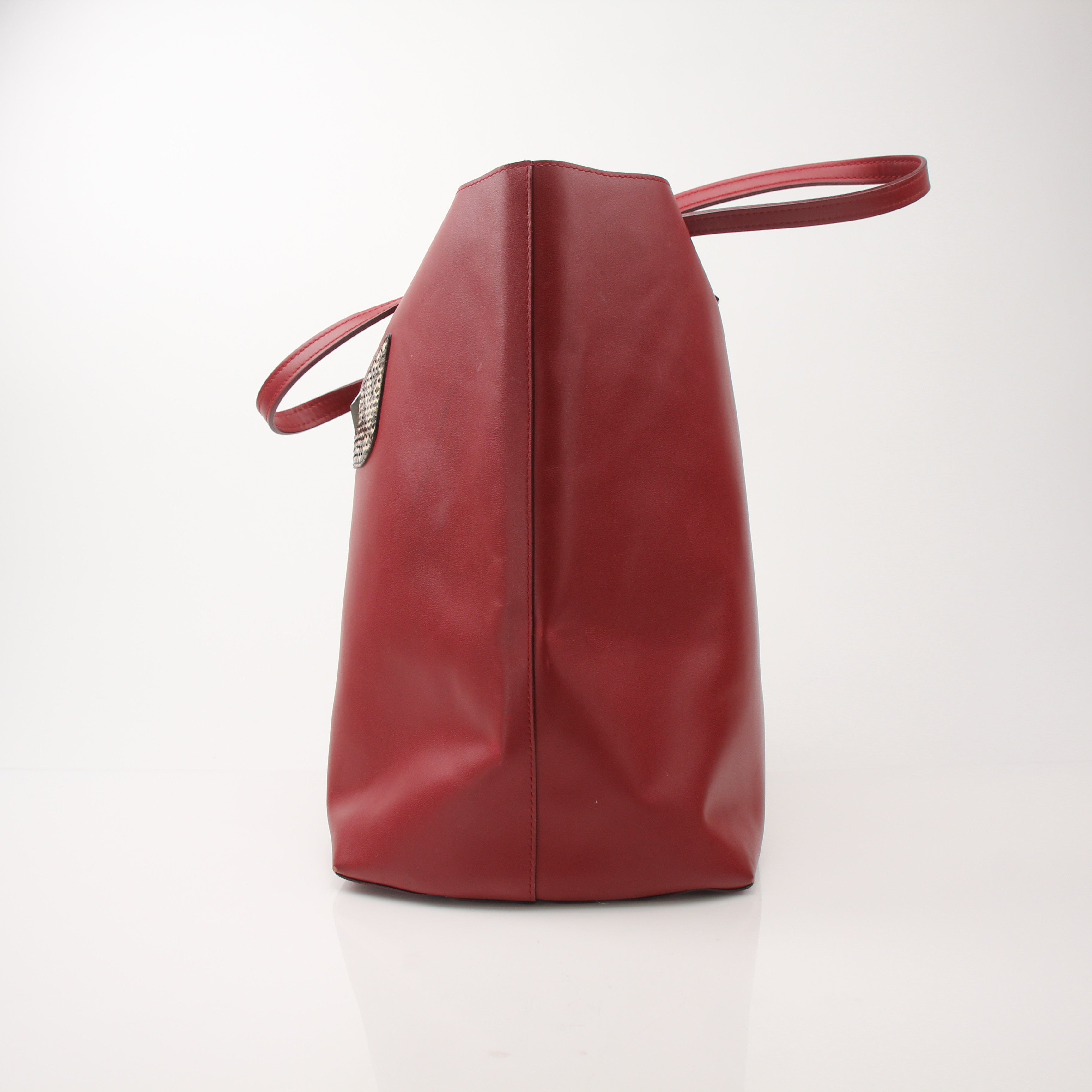 Red Fendi Monster Roll Tote Bag, a stylish handbag with a bold design, featuring prominent monster artwork and structured shape.